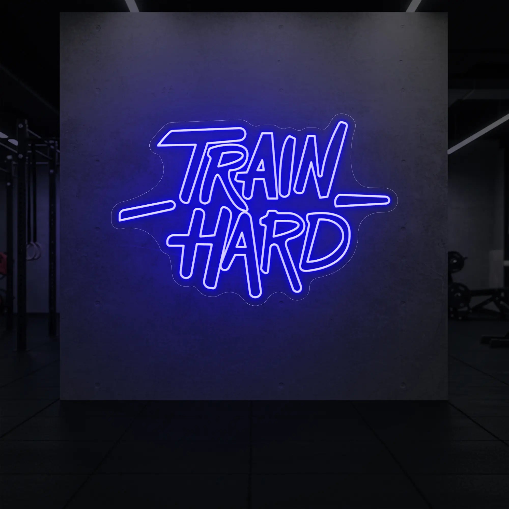 'TRAIN HARD' neon sign glowing in deep blue against a styled interior wall.