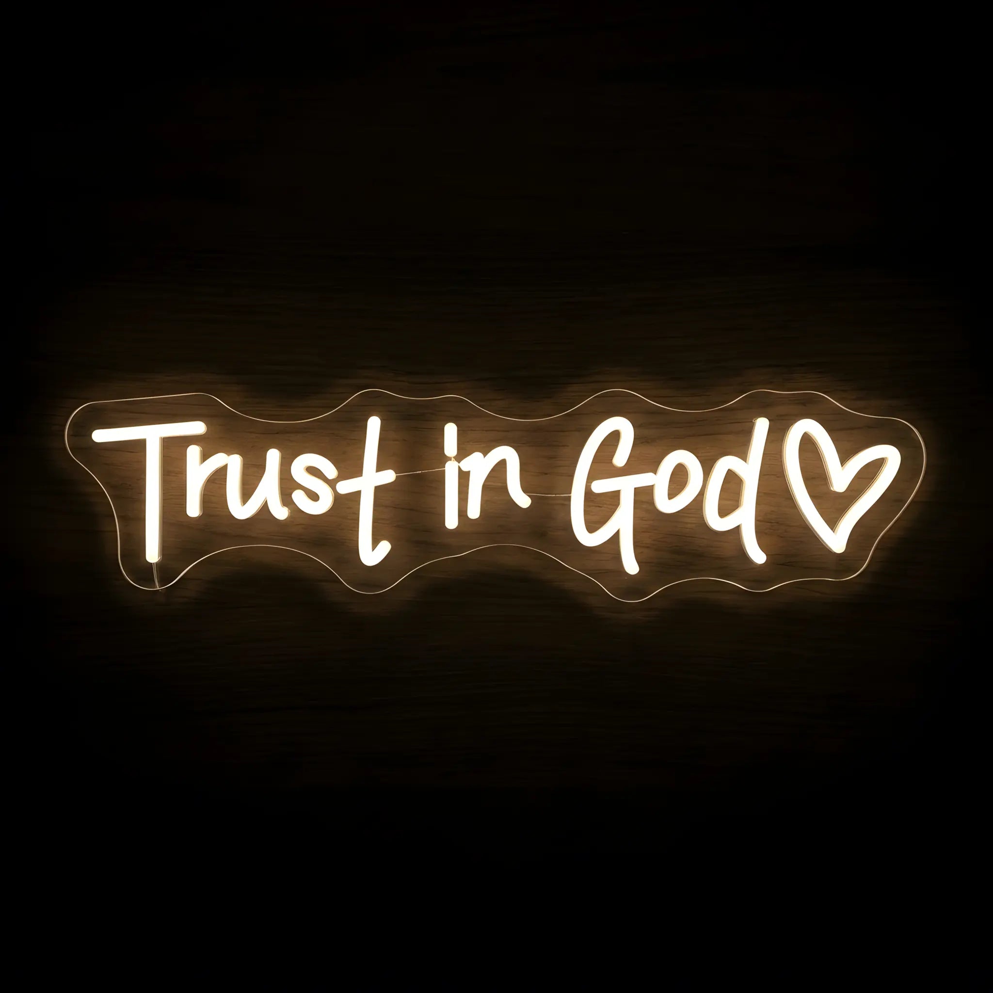 Trust in God LED neon sign with warm white illumination on precision-cut acrylic backing featuring a heart, Christian wall decor with an inspirational faith message.