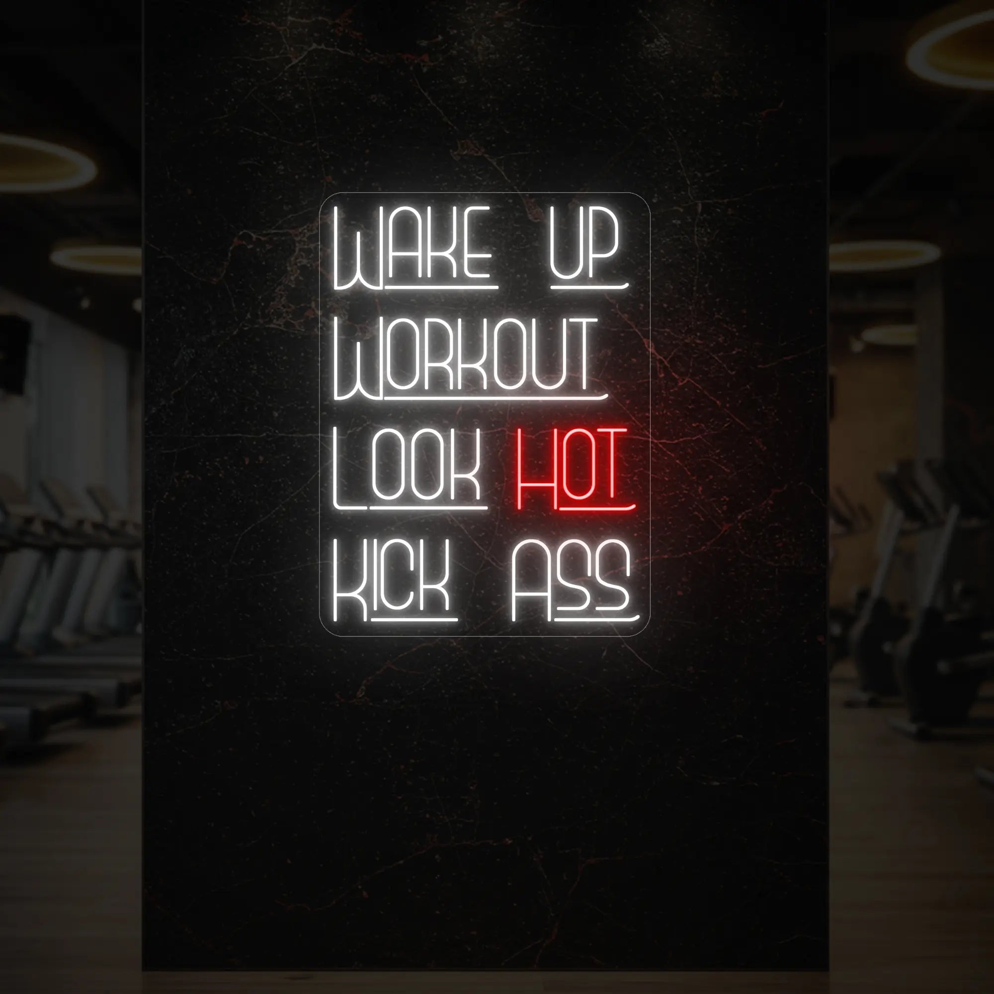 'WAKE UP WORKOUT LOOK HOT KICK ASS' neon sign glowing in red against a styled interior wall.