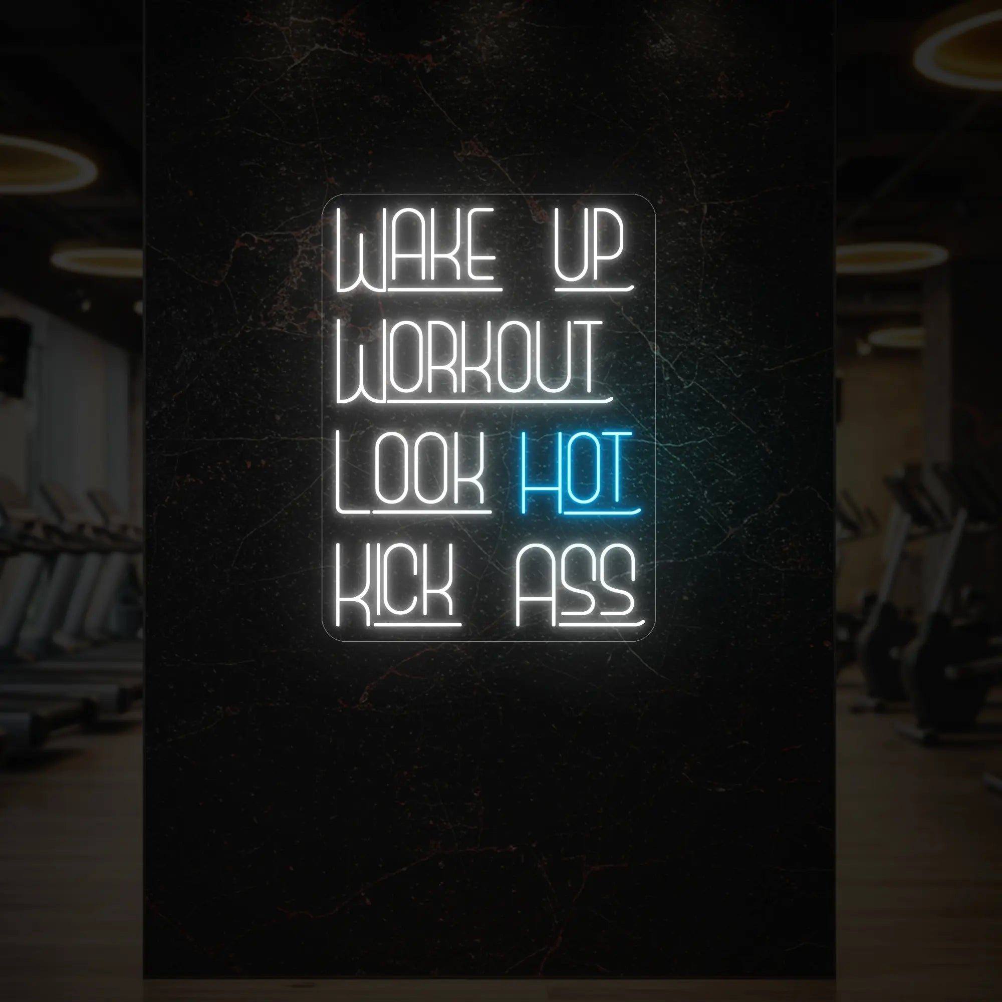 'WAKE UP WORKOUT LOOK HOT KICK ASS' neon sign glowing in ice blue against a styled interior wall.