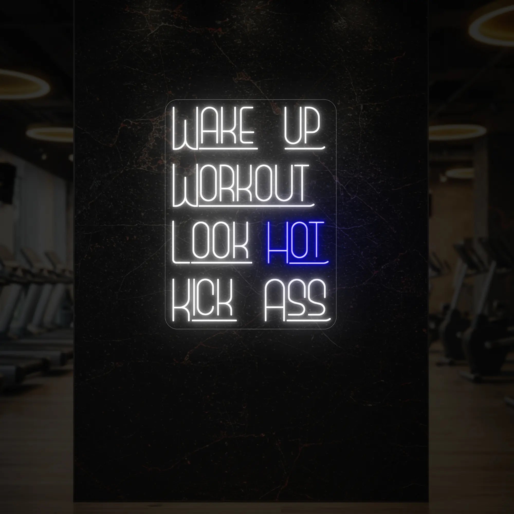 'WAKE UP WORKOUT LOOK HOT KICK ASS' neon sign glowing in deep blue against a styled interior wall.
