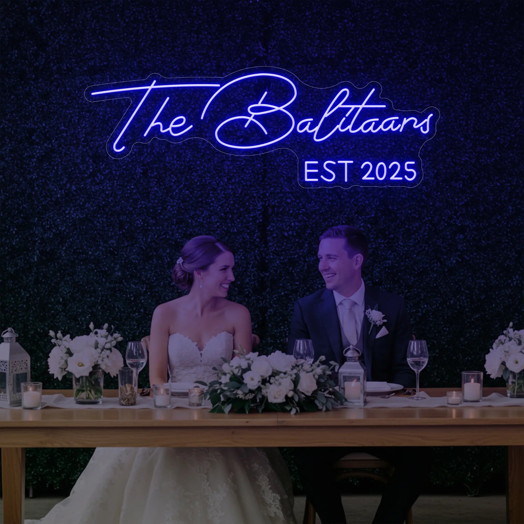 Photo of the 'Wedding Last Names Custom Neon Sign V1' neon sign glowing in deep blue against a styled interior wall.