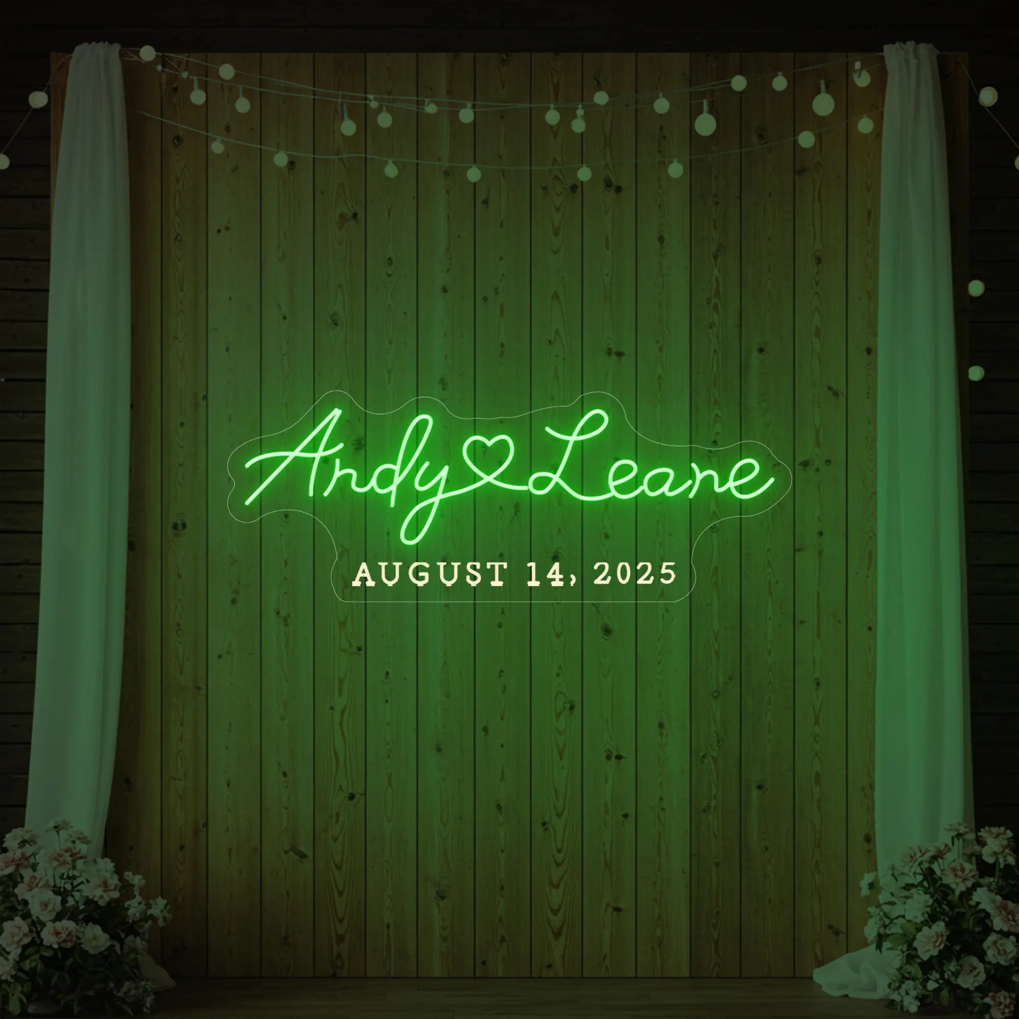 Photo of the 'Wedding First Names Custom Neon Sign' neon sign glowing in green against a styled interior wall.