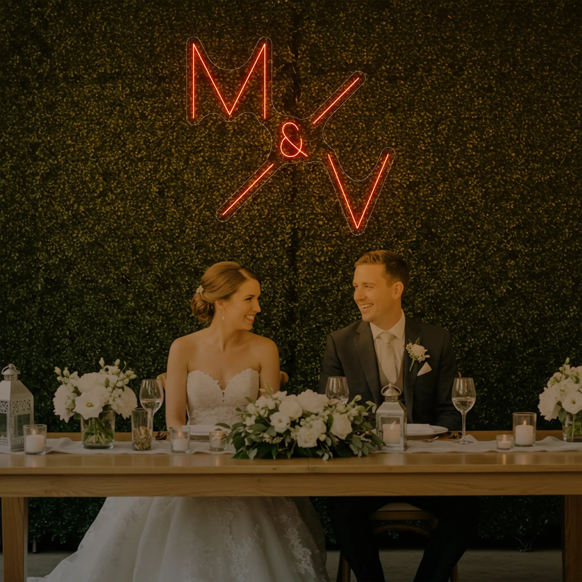 Photo of the 'Wedding Initials Custom Neon Sign V1' neon sign glowing in golden yellow against a styled interior wall.