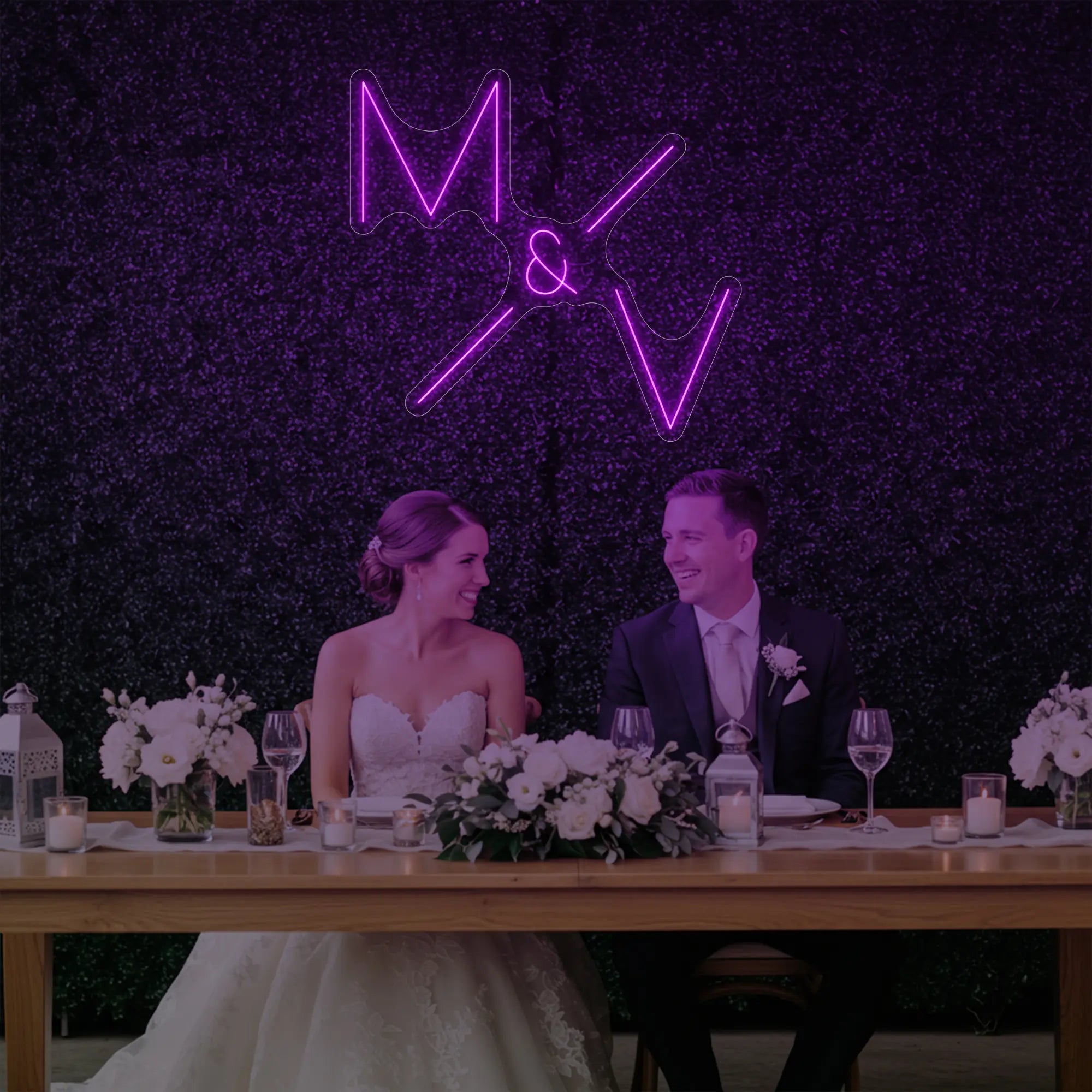 Photo of the 'Wedding Initials Custom Neon Sign V1' neon sign glowing in deep pink against a styled interior wall.
