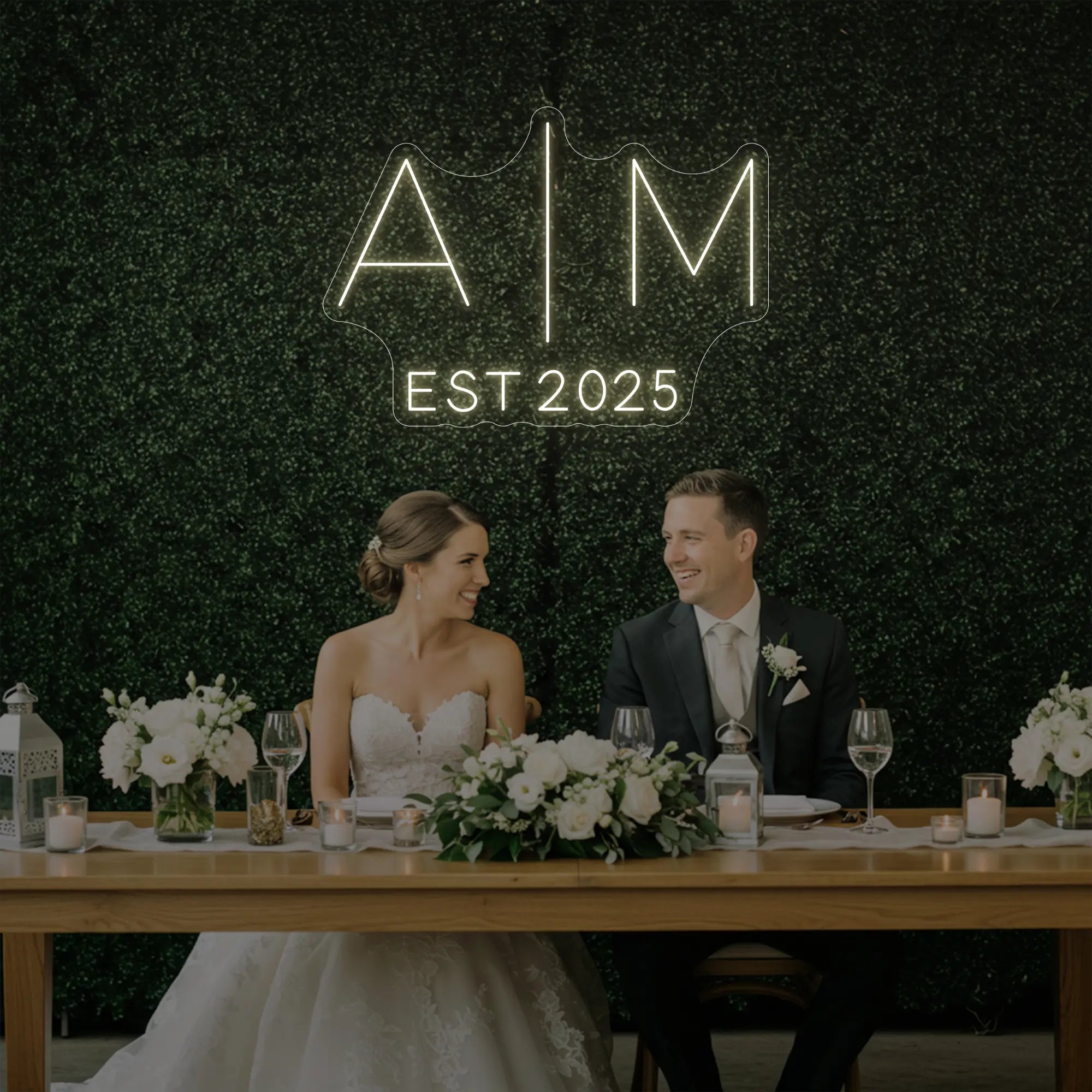 Photo of the 'Wedding Initials Custom Neon Sign V4' neon sign glowing in warm white against a styled interior wall.
