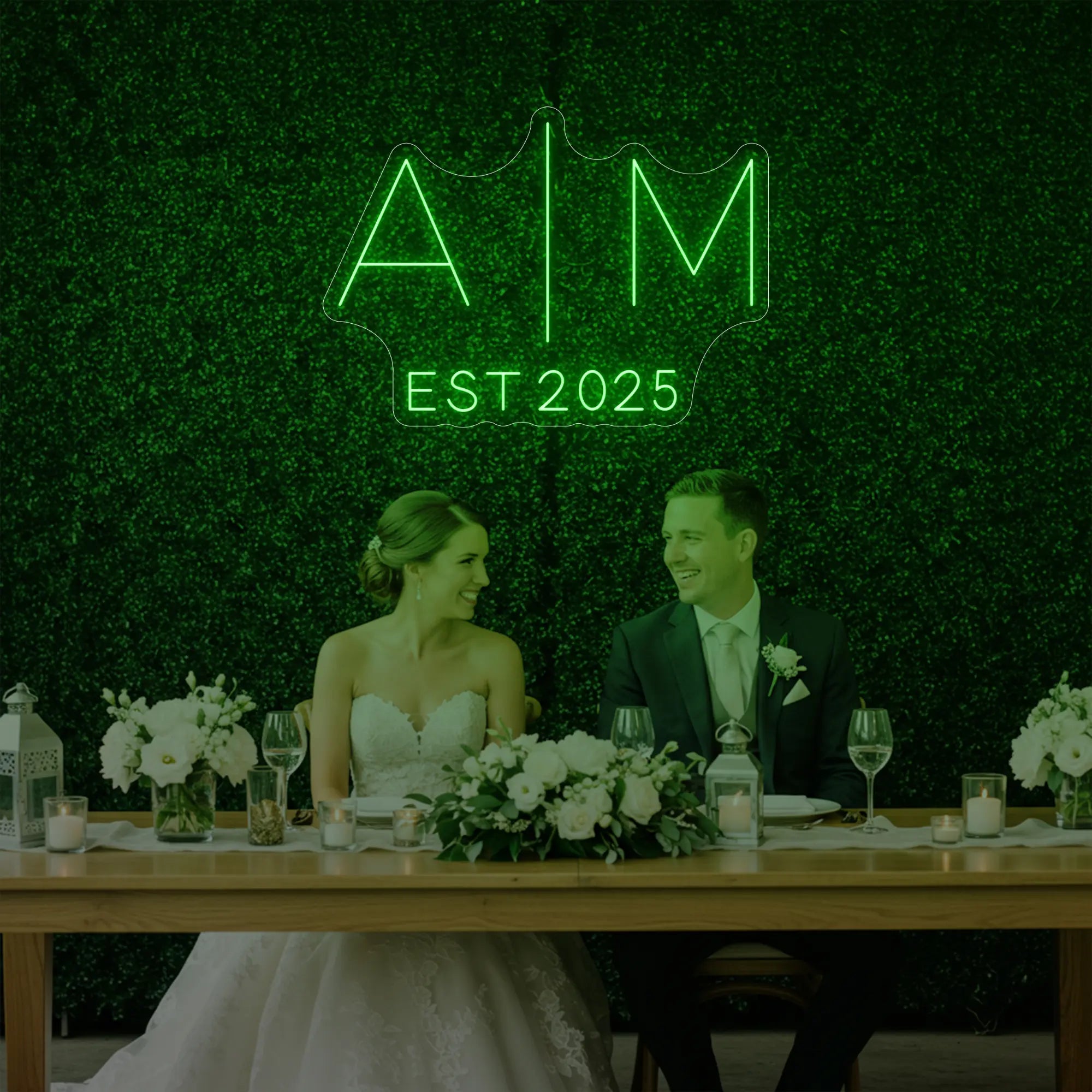 Photo of the 'Wedding Initials Custom Neon Sign V4' neon sign glowing in green against a styled interior wall.