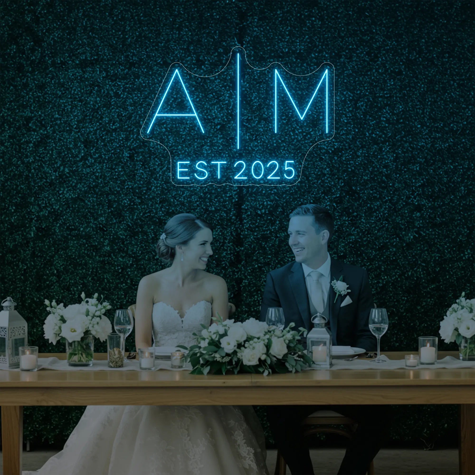 Photo of the 'Wedding Initials Custom Neon Sign V4' neon sign glowing in ice blue against a styled interior wall.