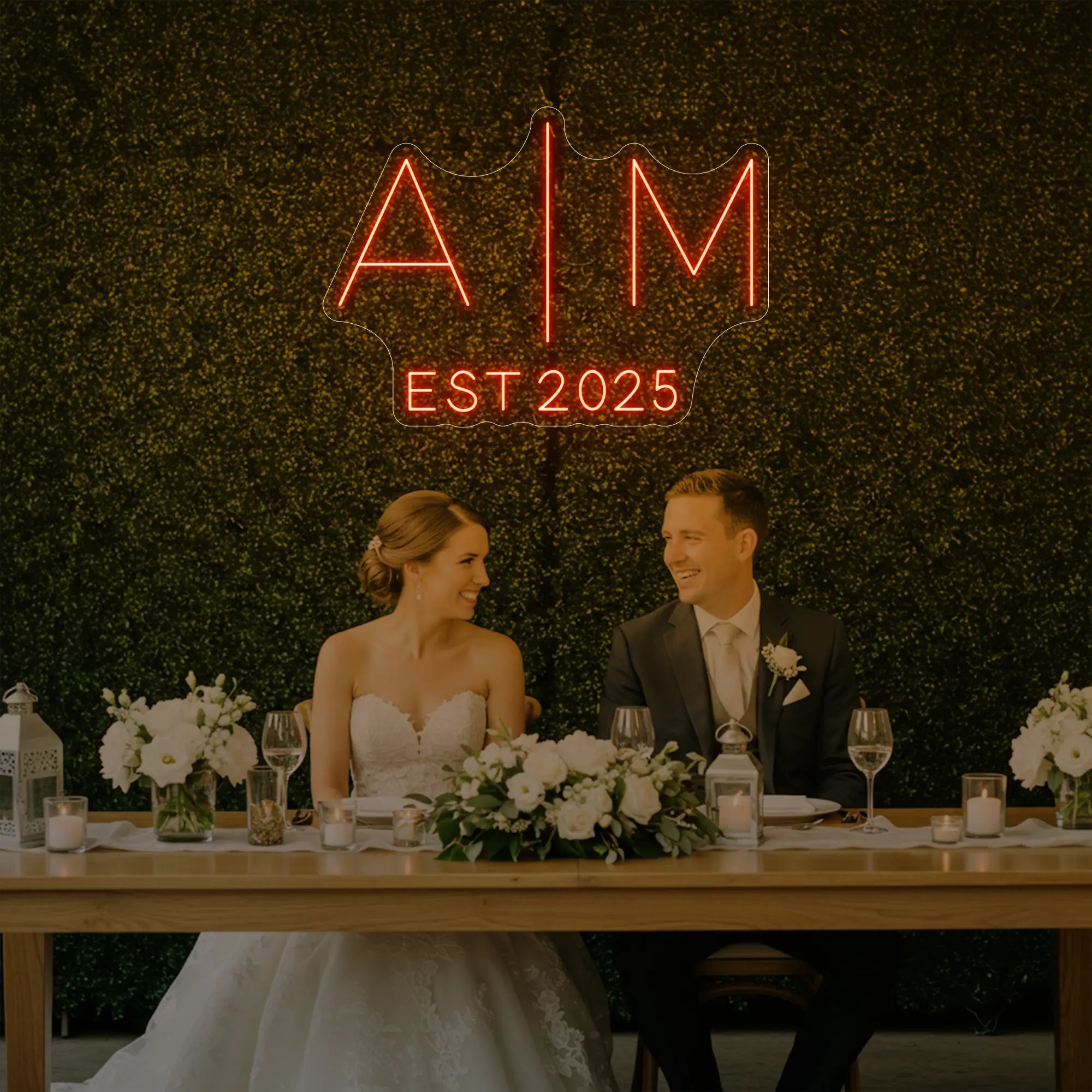 Photo of the 'Wedding Initials Custom Neon Sign V4' neon sign glowing in golden yellow against a styled interior wall.