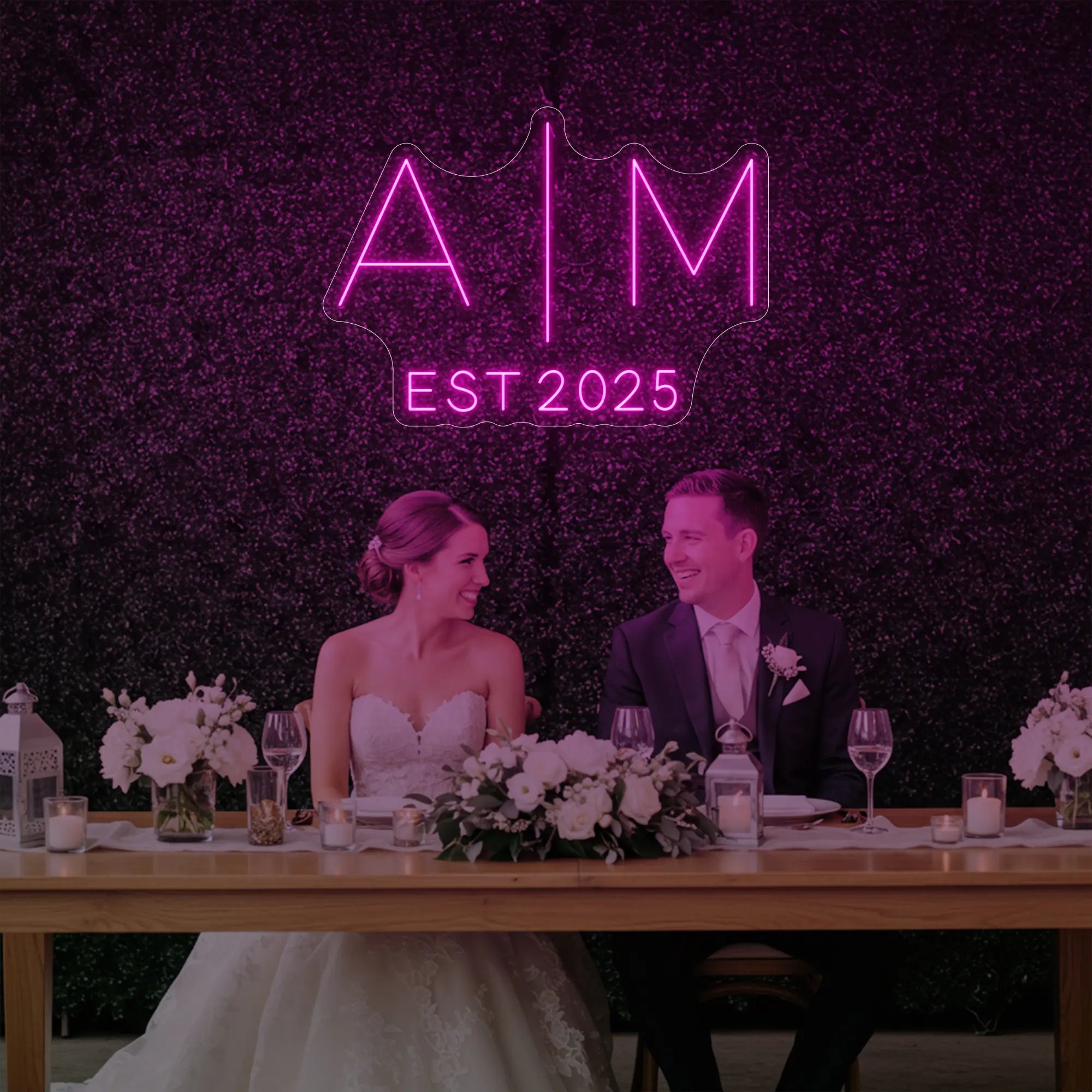 Photo of the 'Wedding Initials Custom Neon Sign V4' neon sign glowing in light pink against a styled interior wall.