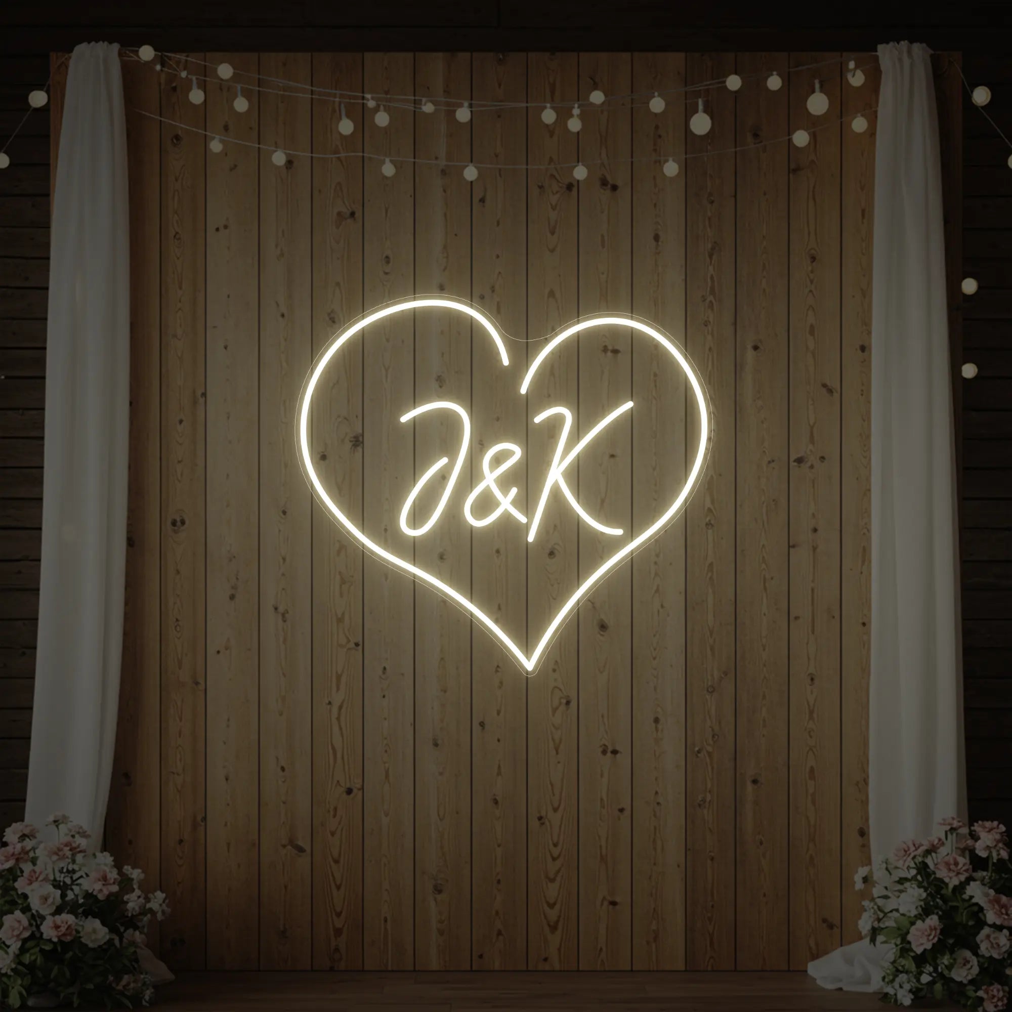 Photo of the 'Wedding Initials Custom Neon Sign V5' neon sign glowing in warm white against a styled interior wall.