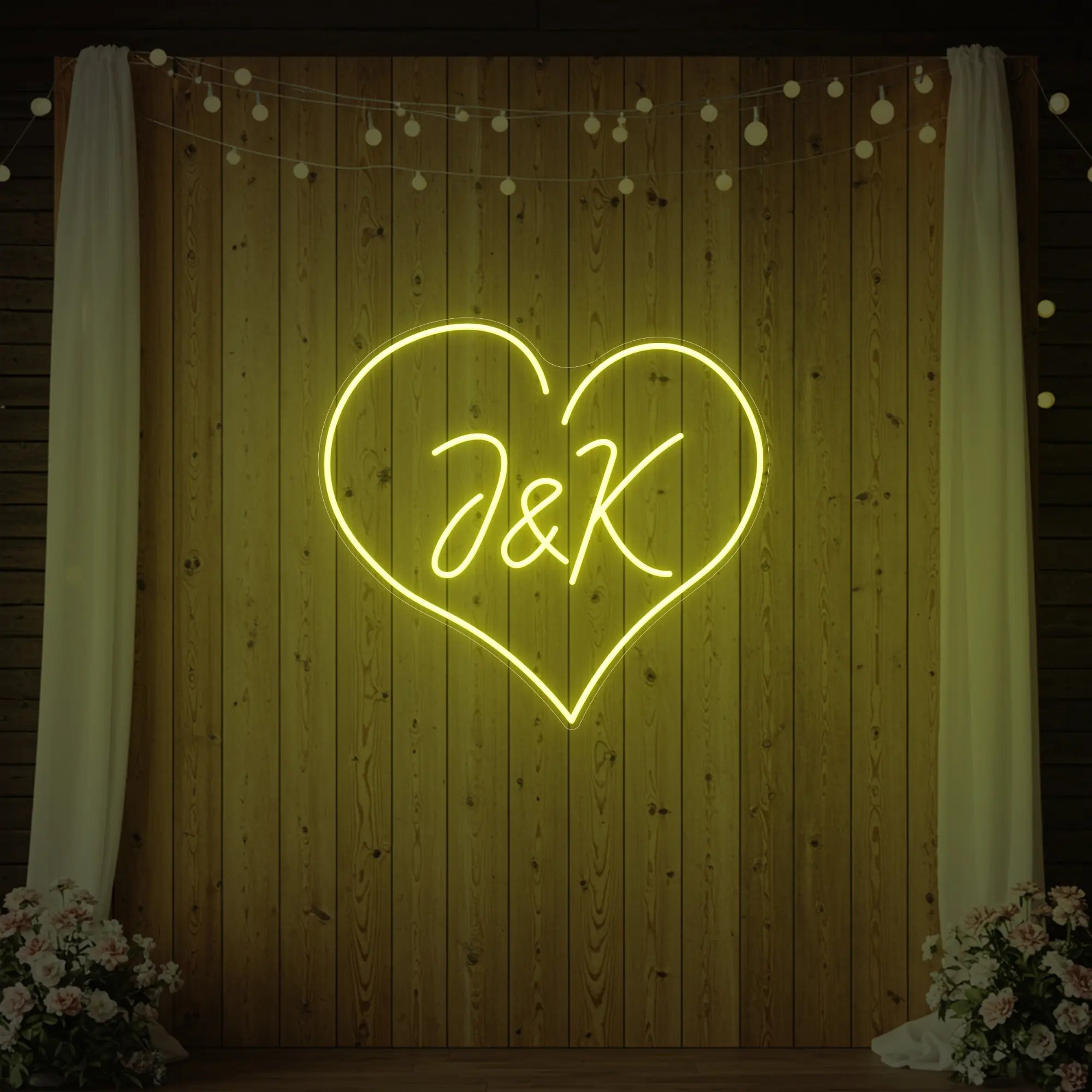 Photo of the 'Wedding Initials Custom Neon Sign V5' neon sign glowing in lemon yellow against a styled interior wall.