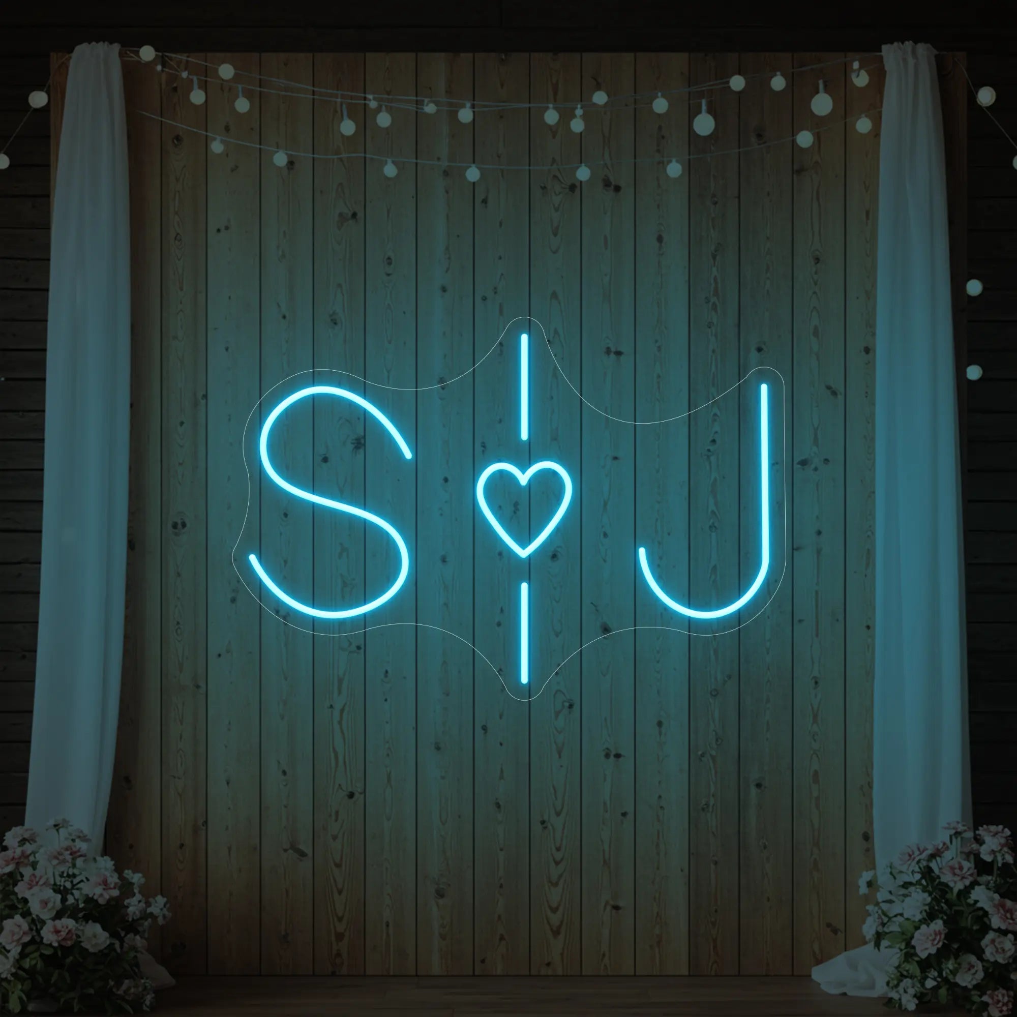 Photo of the 'Wedding Initials Custom Neon Sign V6' neon sign glowing in ice blue against a styled interior wall.