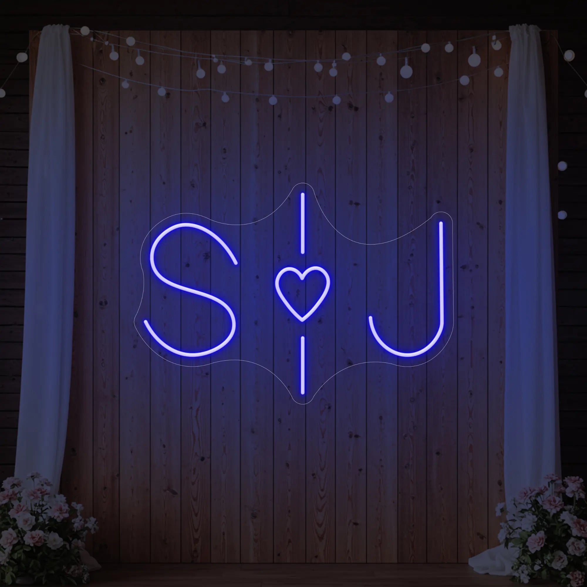 Photo of the 'Wedding Initials Custom Neon Sign V6' neon sign glowing in deep blue against a styled interior wall.