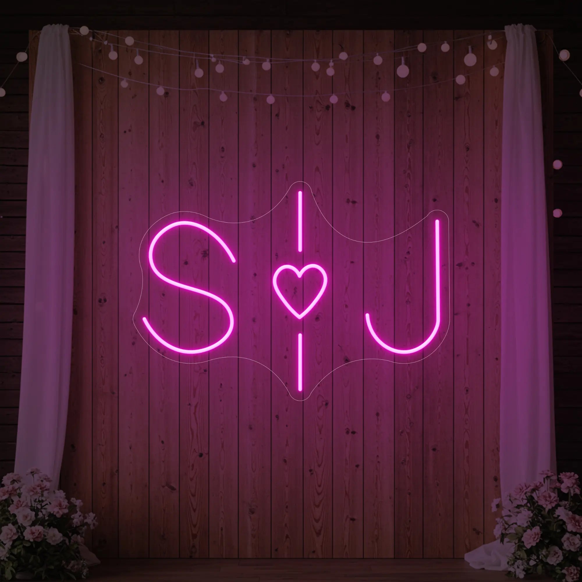 Photo of the 'Wedding Initials Custom Neon Sign V6' neon sign glowing in light pink against a styled interior wall.