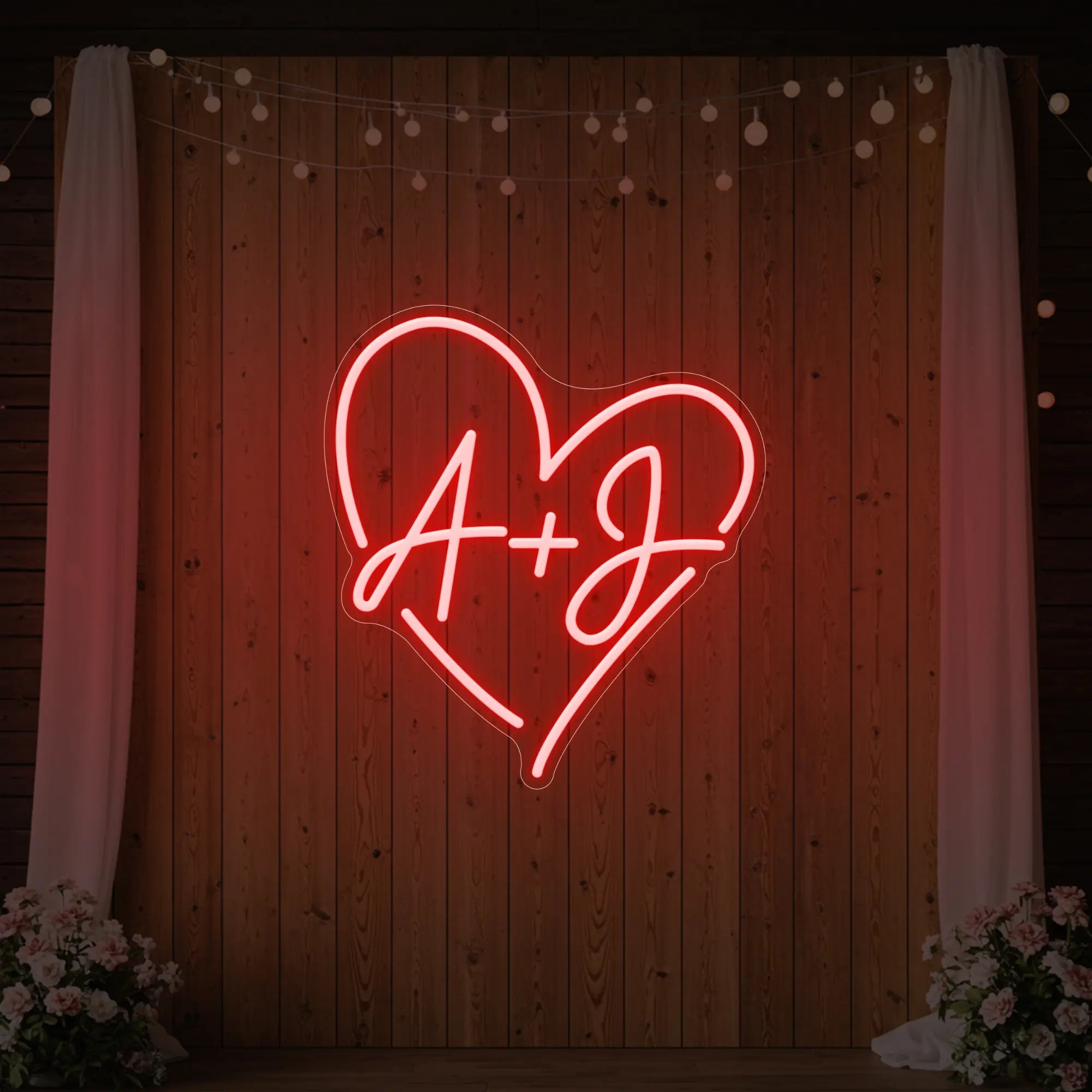 Photo of the 'Wedding Initials Custom Neon Sign V7' neon sign glowing in red against a styled interior wall.