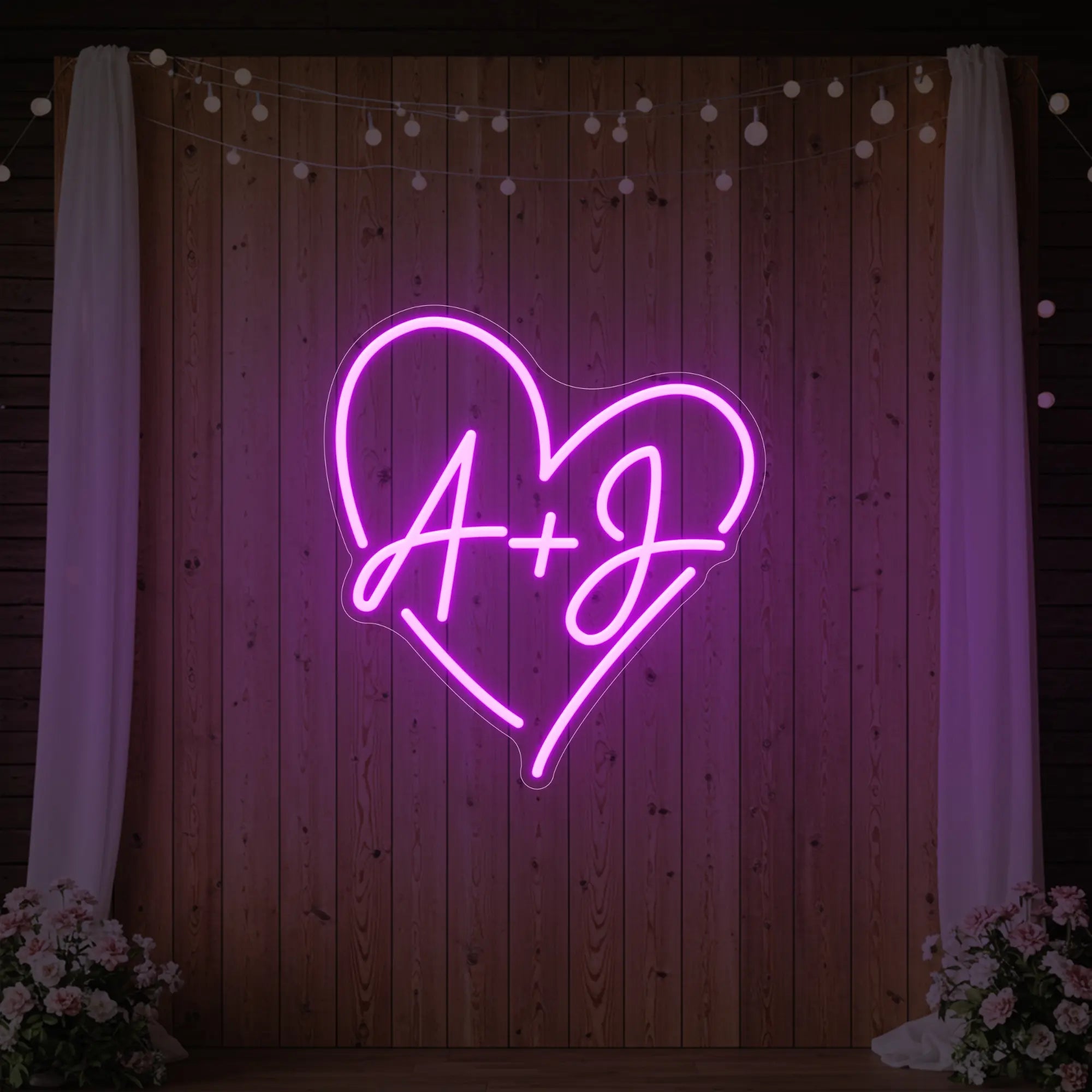 Photo of the 'Wedding Initials Custom Neon Sign V7' neon sign glowing in deep pink against a styled interior wall.