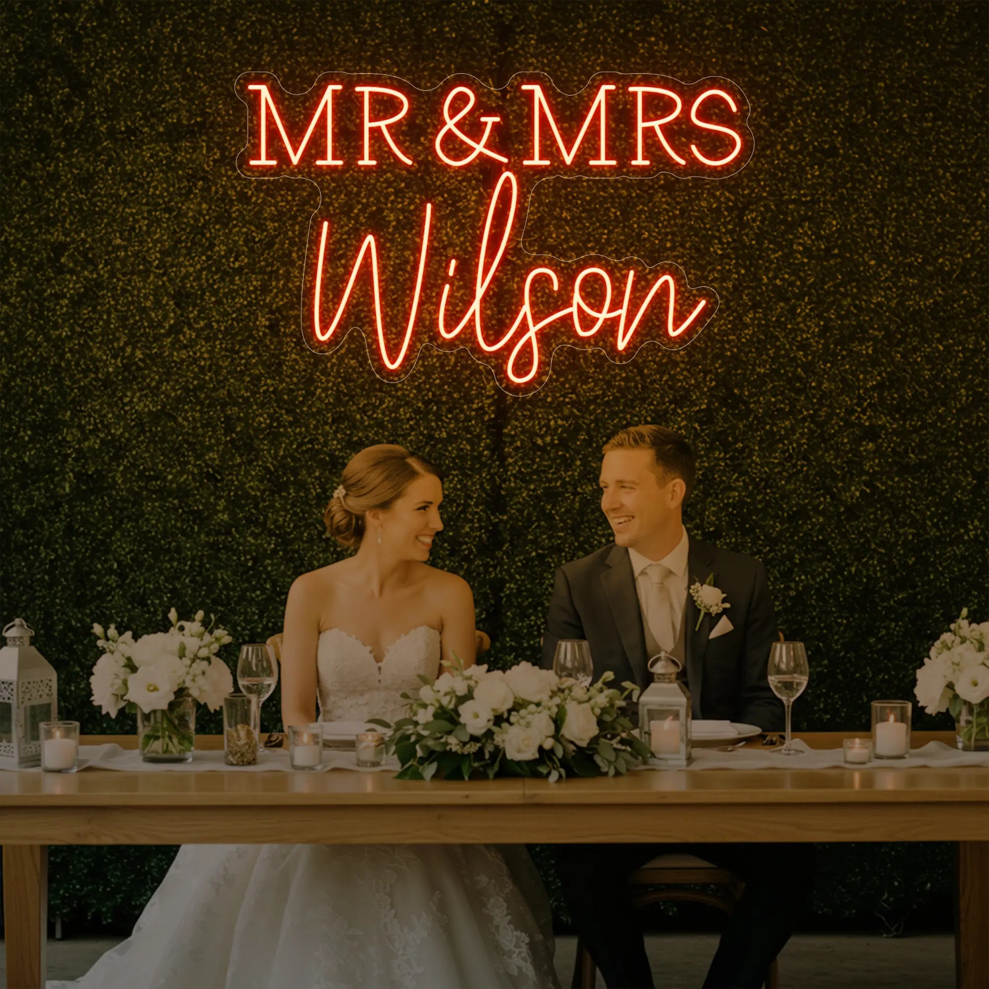 Photo of the 'Wedding Last Names Custom Neon Sign V2' neon sign glowing in golden yellow against a styled interior wall.