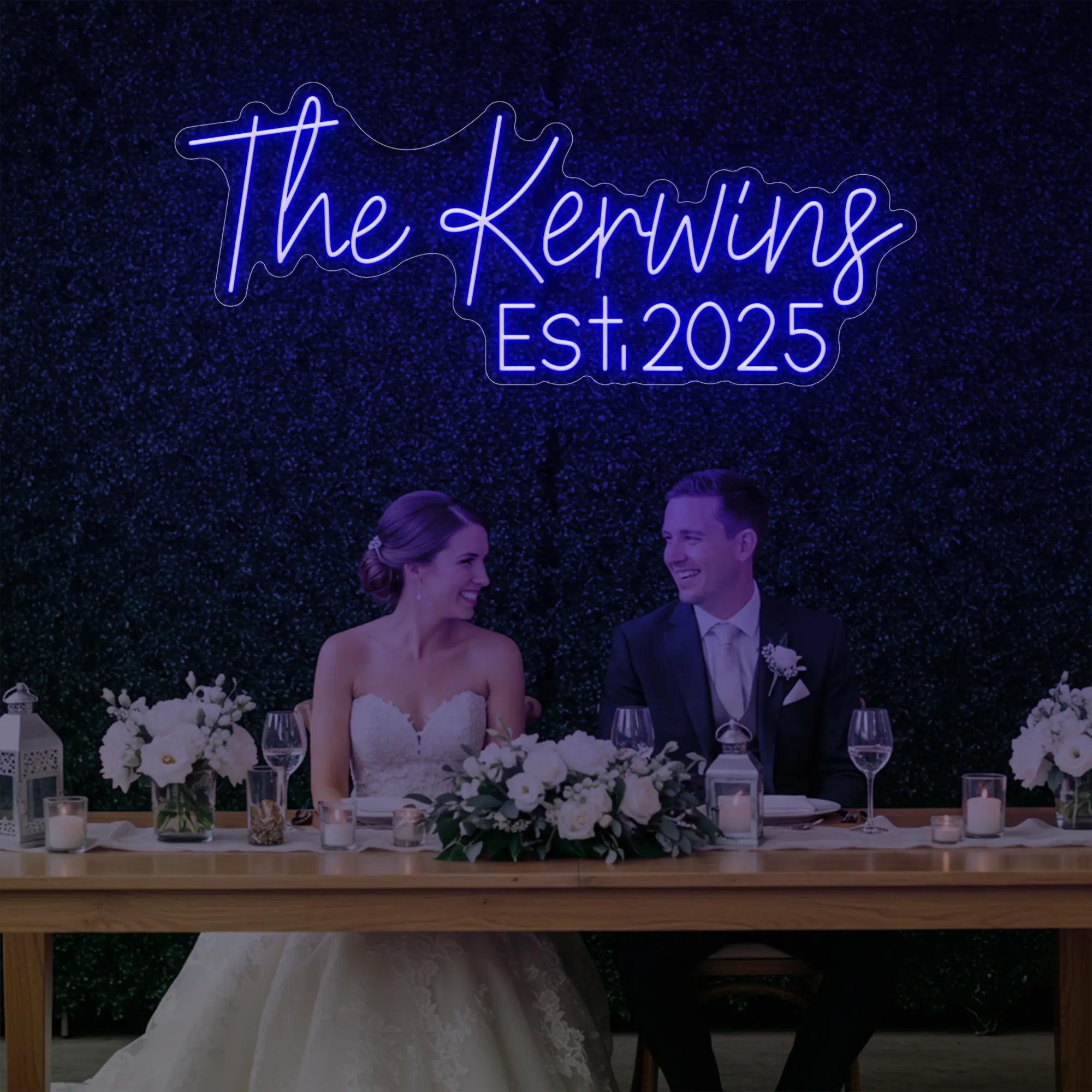 Photo of the 'Wedding Last Names Custom Neon Sign V5' neon sign glowing in deep blue against a styled interior wall.
