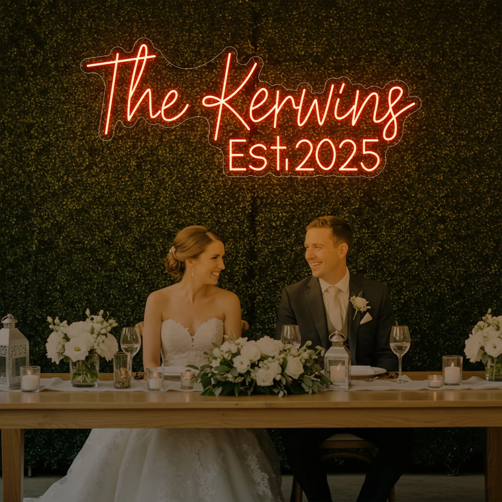 Photo of the 'Wedding Last Names Custom Neon Sign V5' neon sign glowing in golden yellow against a styled interior wall.