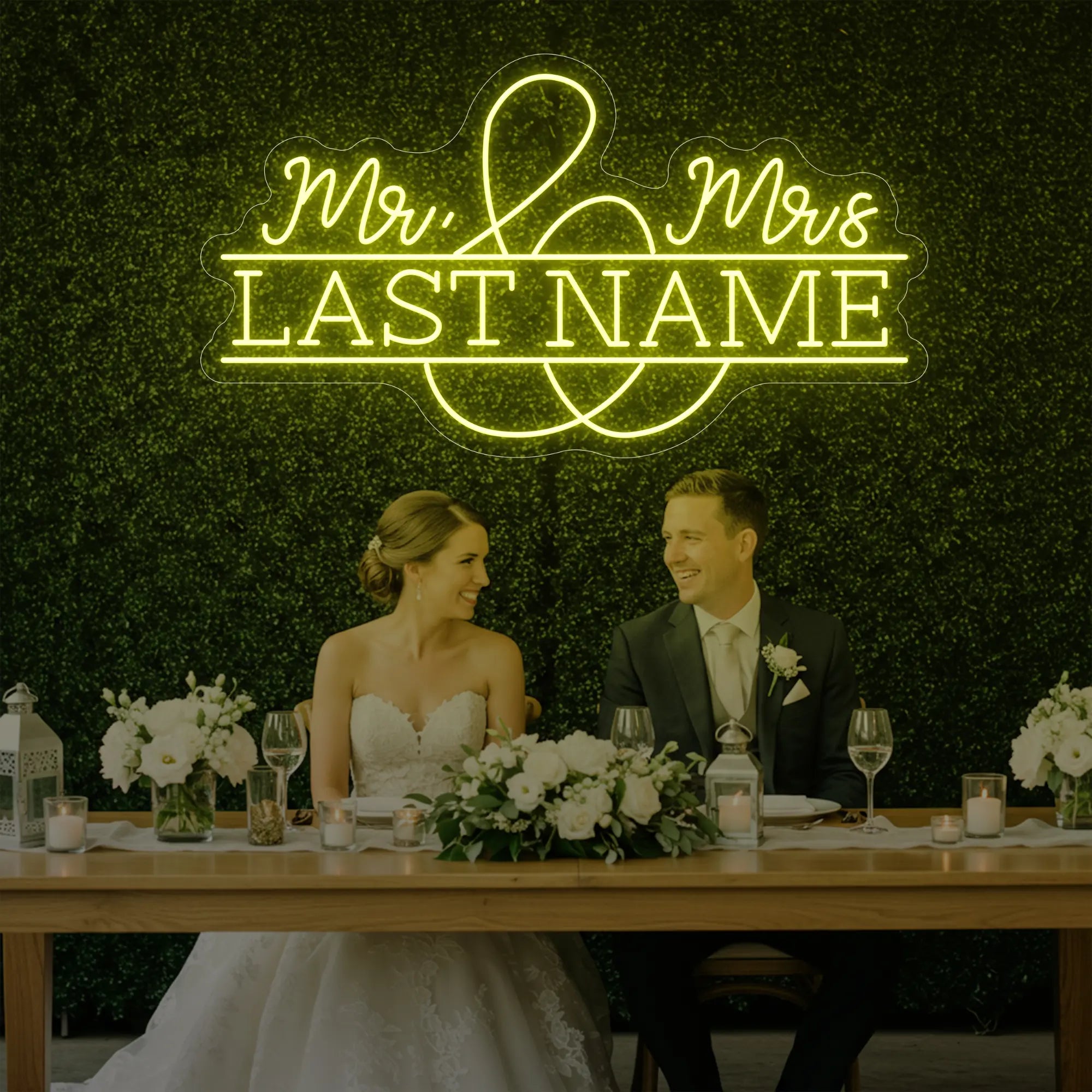 Photo of the 'Wedding Last Names Custom Neon Sign V6' neon sign glowing in lemon yellow against a styled interior wall.