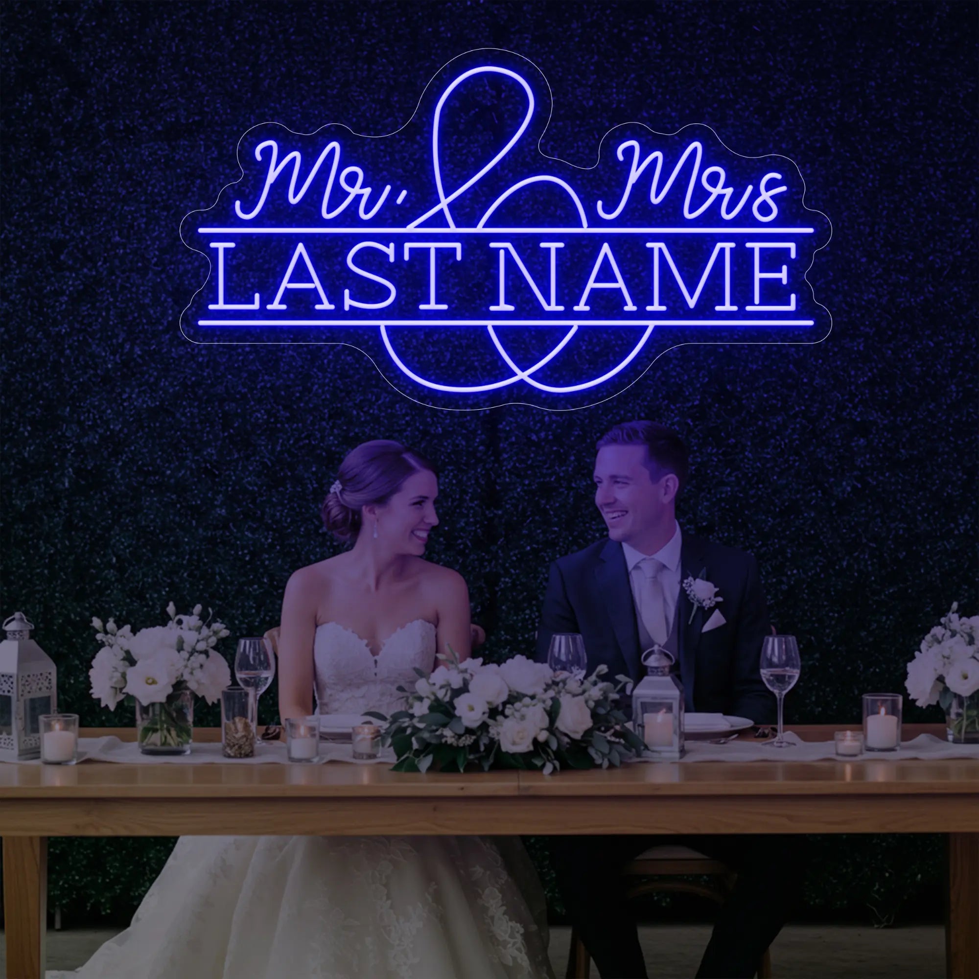 Photo of the 'Wedding Last Names Custom Neon Sign V6' neon sign glowing in deep blue against a styled interior wall.