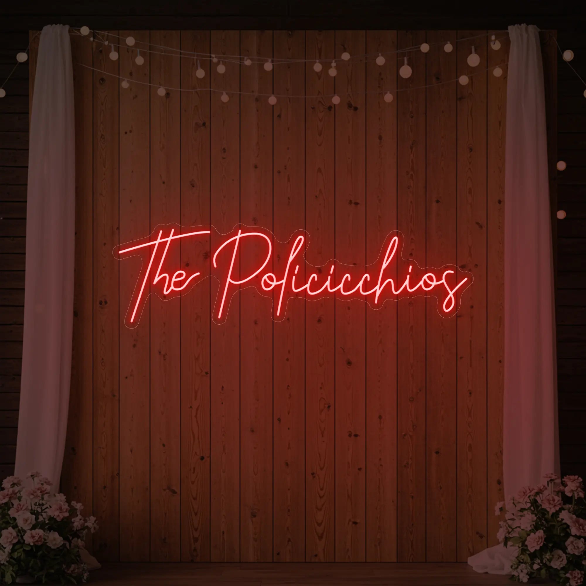 Photo of the 'Wedding Last Names Custom Neon Sign V7' neon sign glowing in red against a styled interior wall.