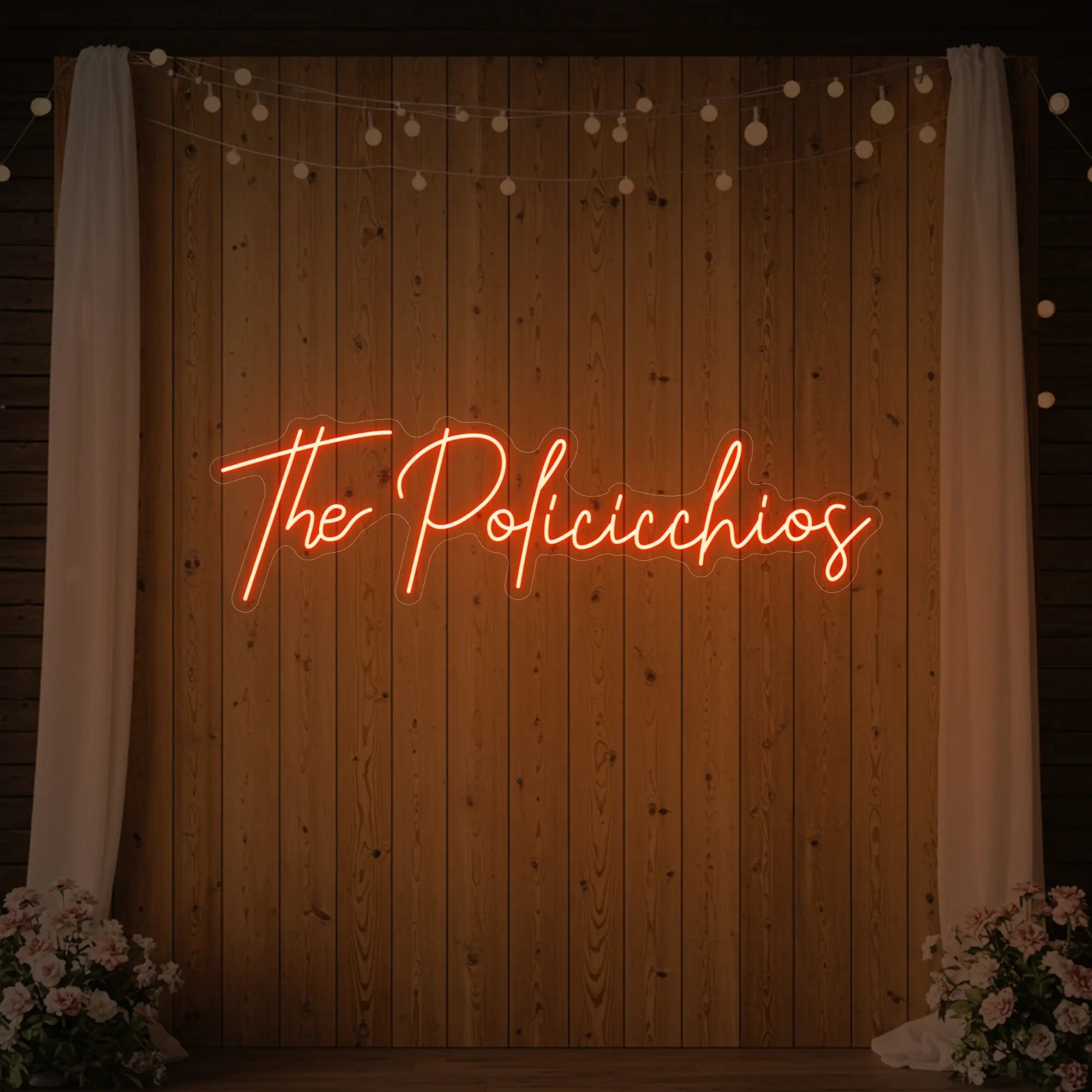 Photo of the 'Wedding Last Names Custom Neon Sign V7' neon sign glowing in golden yellow against a styled interior wall.