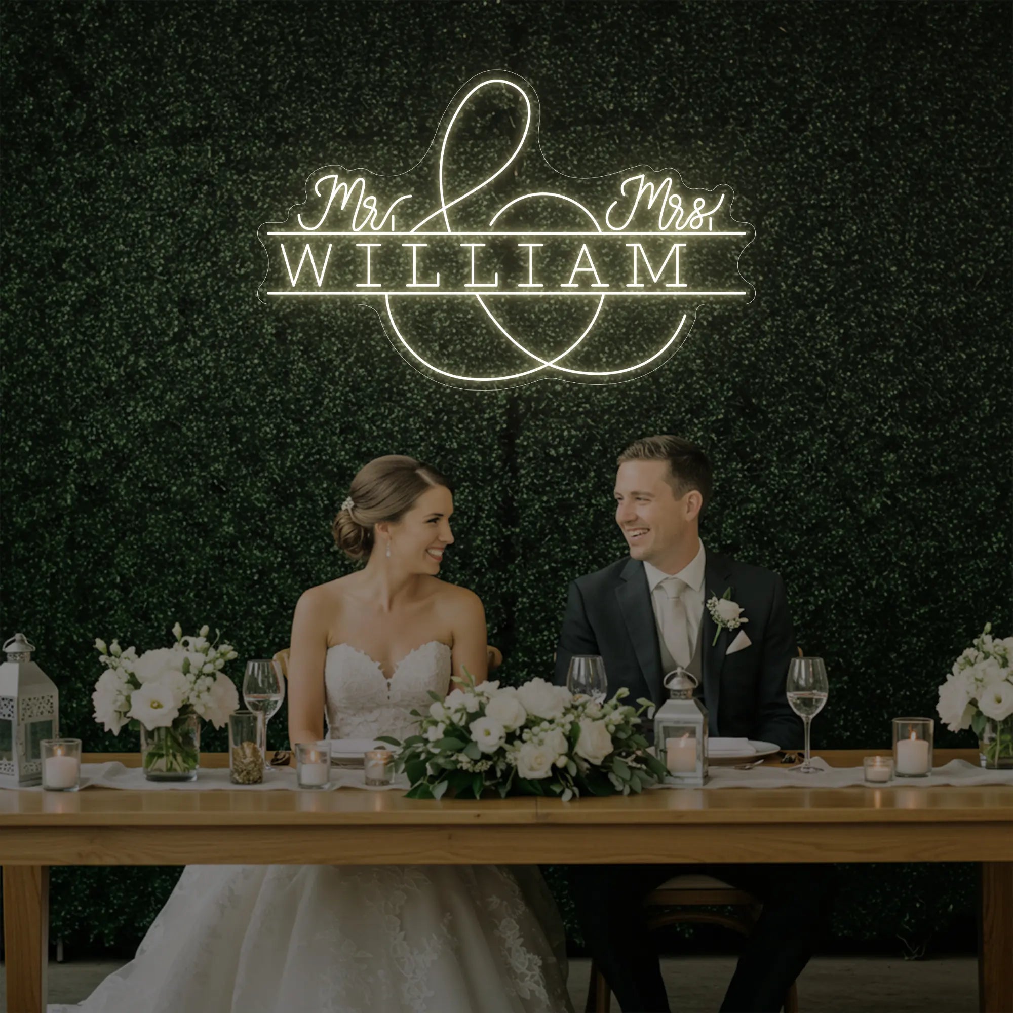 Photo of the 'Wedding Last Names Custom Neon Sign V3' neon sign glowing in warm white against a styled interior wall.