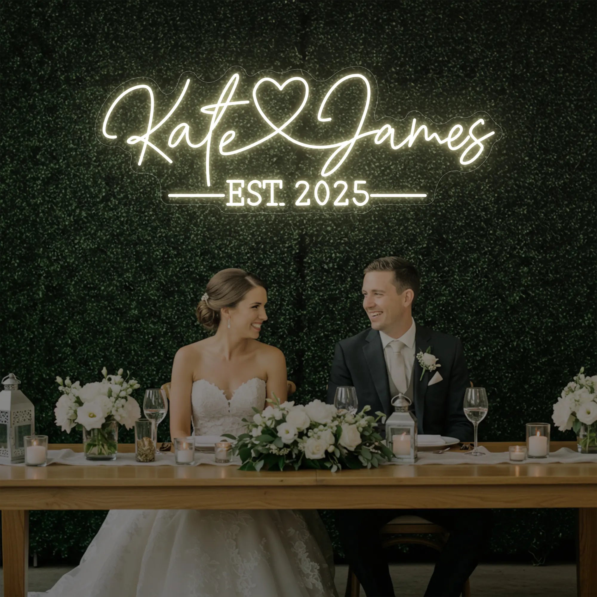 Photo of the 'Wedding Names Custom Neon Sign' neon sign glowing in warm white against a styled interior wall.