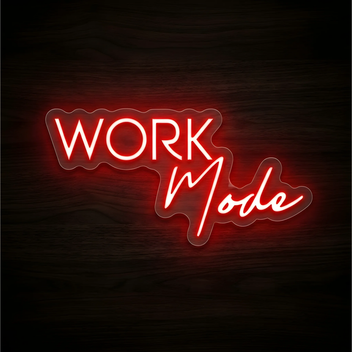Work in Mode LED Neon Sign with red uppercase “WORK” lettering and red script “in Mode” on clear acrylic against a dark wood background, suited to home offices and workspaces.