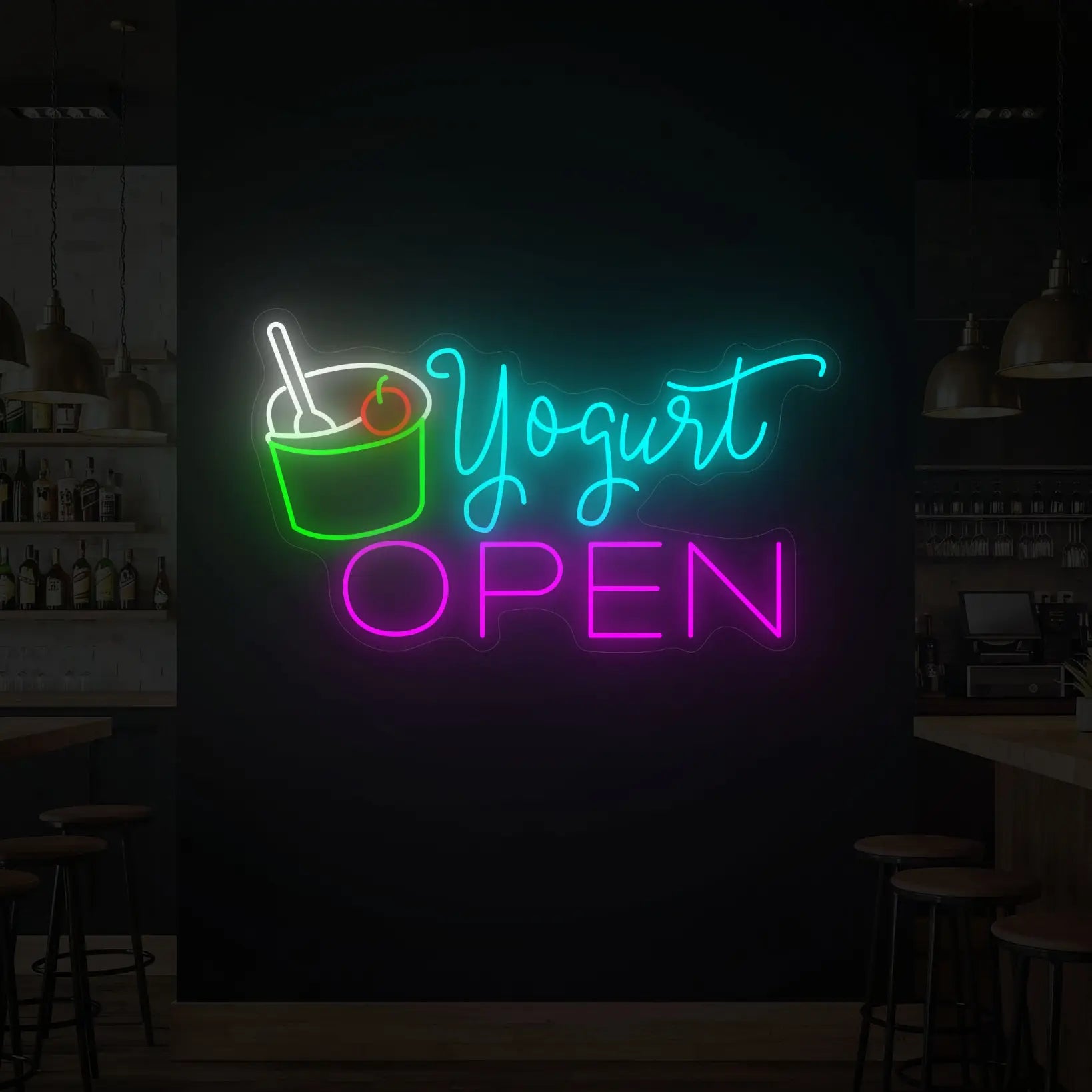 Photo of the 'YOGURT OPEN' neon sign glowing in multi-color against a styled interior wall.