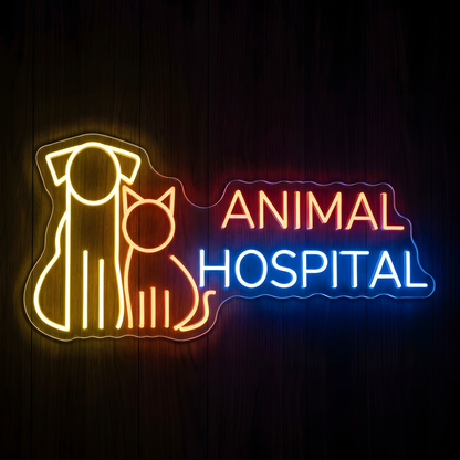 Animal Hospital Pets LED Neon Sign featuring glowing yellow and orange dog and cat outlines beside orange ANIMAL and bright blue HOSPITAL lettering on clear acrylic backing against a dark wood wall.