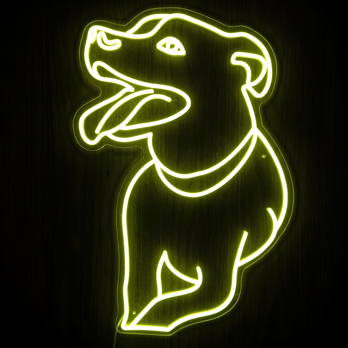 Happy Pitbull LED Neon Sign featuring a bright yellow-green outline of a smiling pitbull dog with its tongue out, mounted on clear acrylic against a dark wood background for dog lovers, pet shops, grooming salons, veterinary clinics, and pet-themed decor.
