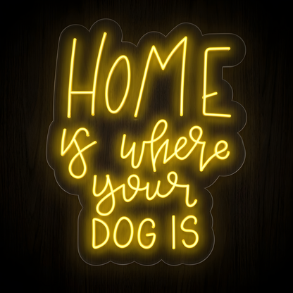 Home Is Where Your Dog Is LED Neon Sign featuring warm yellow glowing handwritten and script lettering on clear acrylic against a dark wood wall, perfect for dog lover home decor, pet rooms, entryways, and pet-friendly spaces.