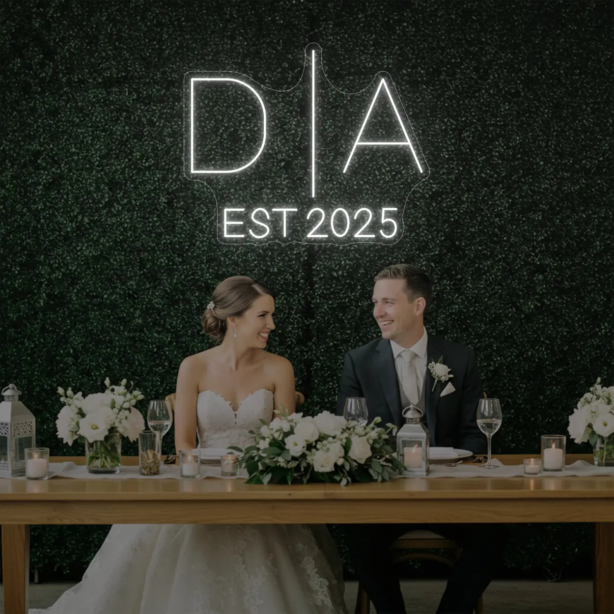 Photo of the 'Wedding Initials Custom Neon Sign V3' neon sign glowing in cool white against a styled interior wall.