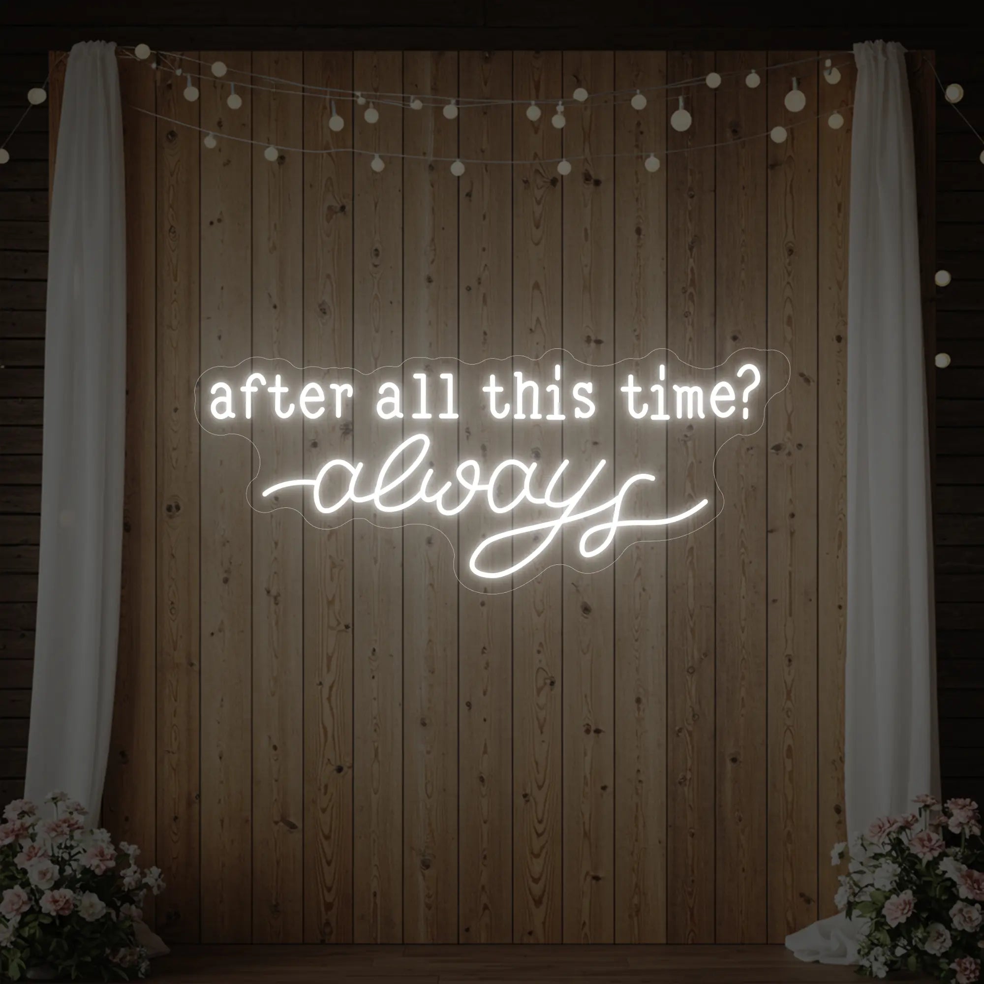 Photo of the 'After All This Time V1' neon sign glowing in cool white against a styled interior wall.