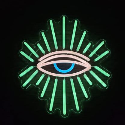 All Seeing Eye LED Neon Sign featuring a glowing eye with green radiant beams, soft pink outlines, and a blue center.