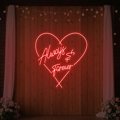 Photo of the 'Always & Forever' neon sign glowing in red against a styled interior wall.