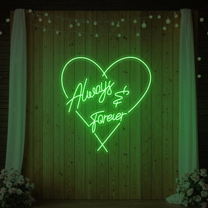 Photo of the 'Always & Forever' neon sign glowing in green against a styled interior wall.