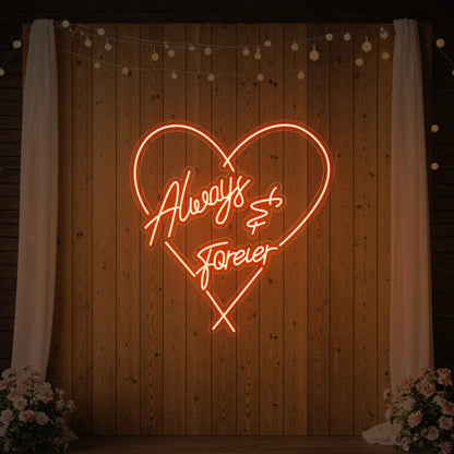Photo of the 'Always & Forever' neon sign glowing in golden yellow against a styled interior wall.
