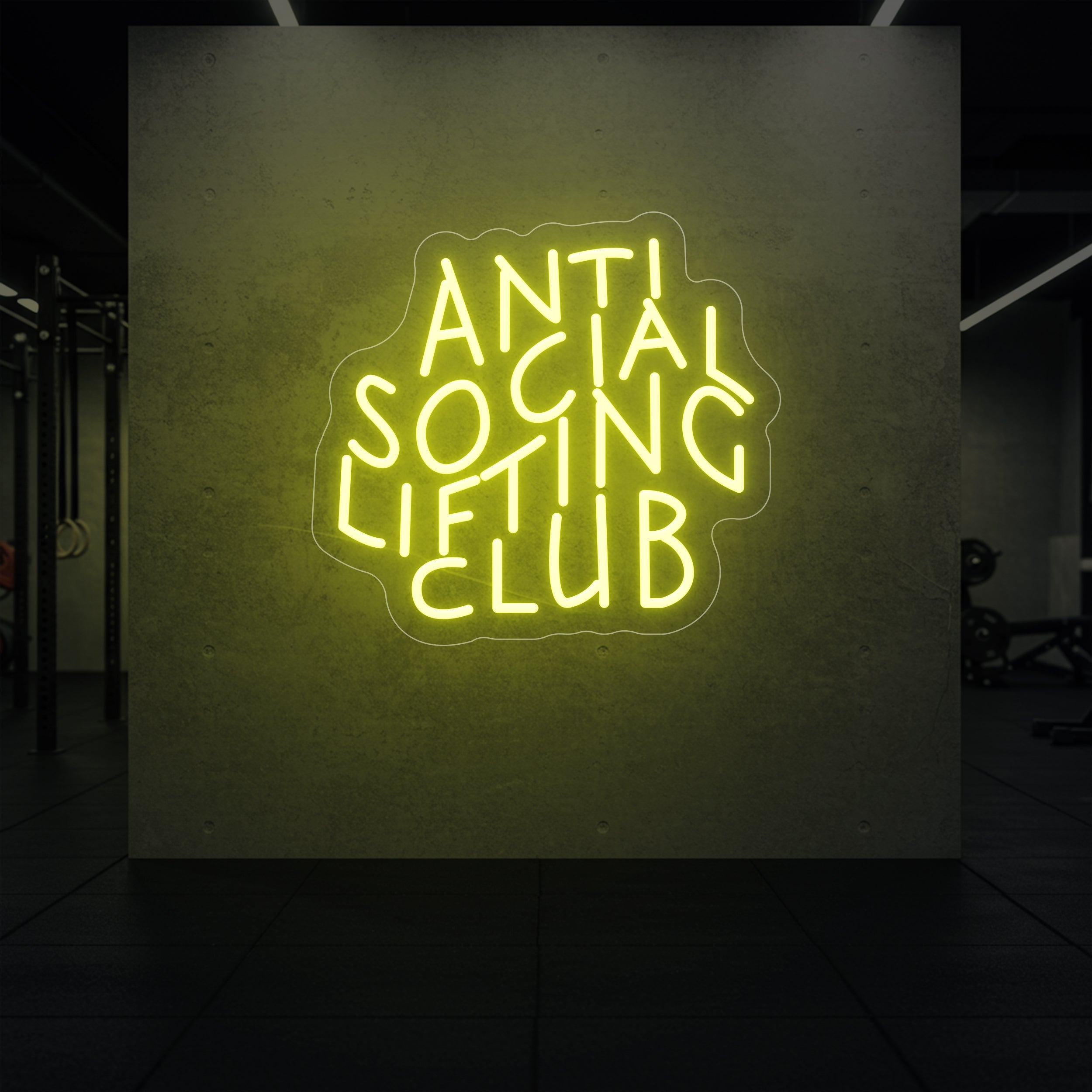 'Anti Social Lifting Club' neon sign glowing in lemon yellow against a styled interior wall.