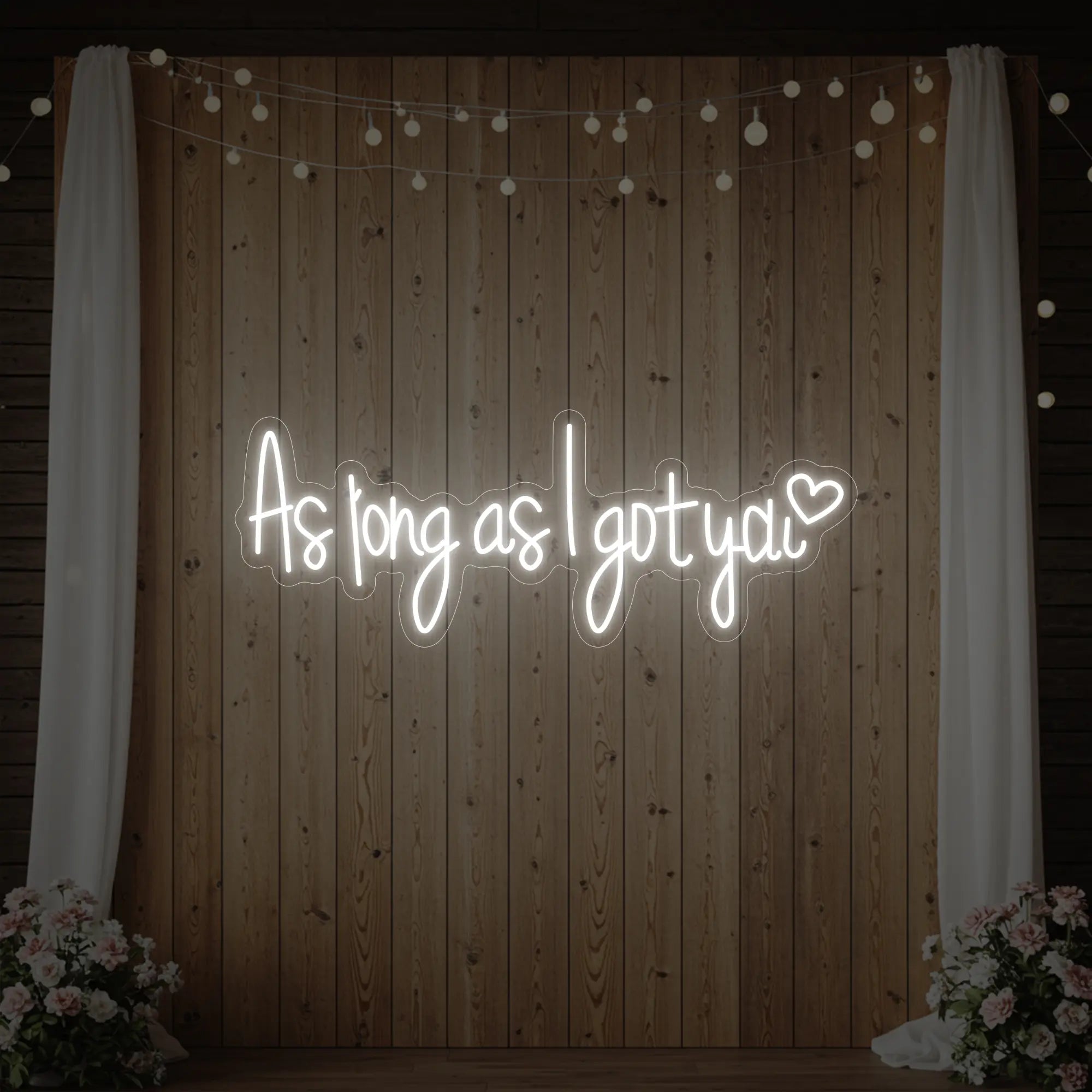 Photo of the 'As Long As I Got You' neon sign glowing in cool white against a styled interior wall.
