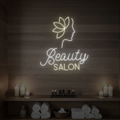 Photo of the 'Beauty Salon' neon sign glowing in cool white and warm white against a styled interior wall.