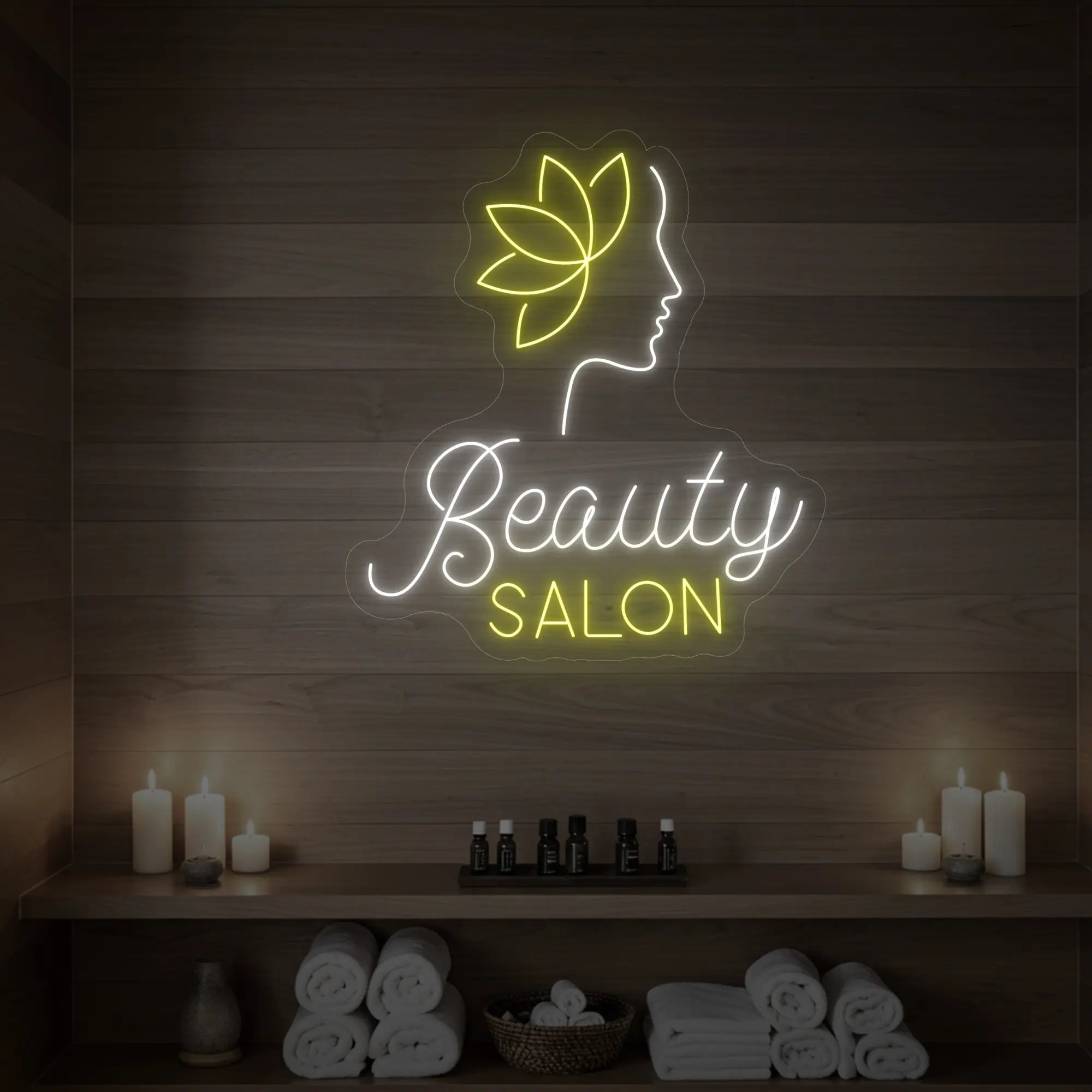 Photo of the 'Beauty Salon' neon sign glowing in cool white and lemon yellow against a styled interior wall.