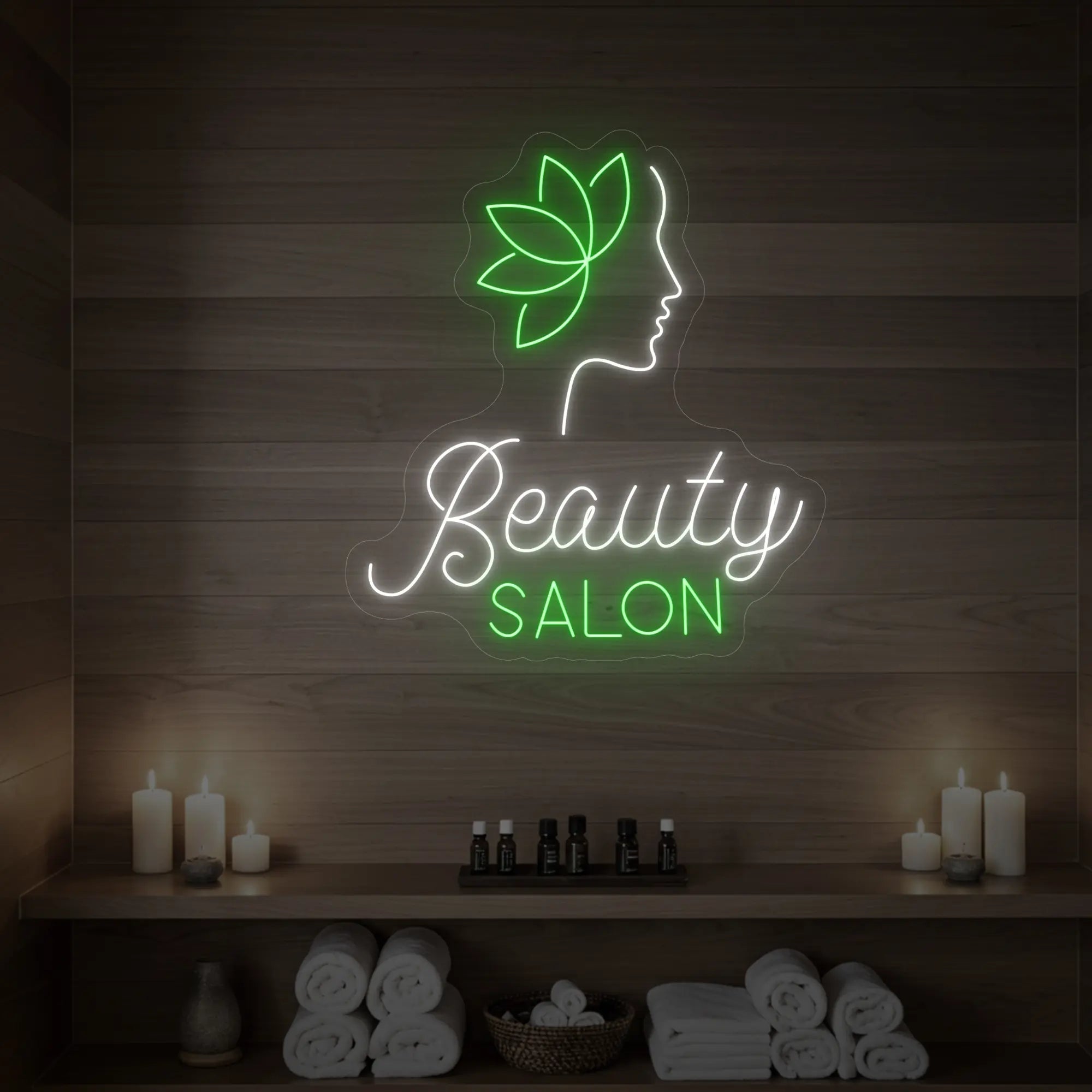 Photo of the 'Beauty Salon' neon sign glowing in cool white and green against a styled interior wall.