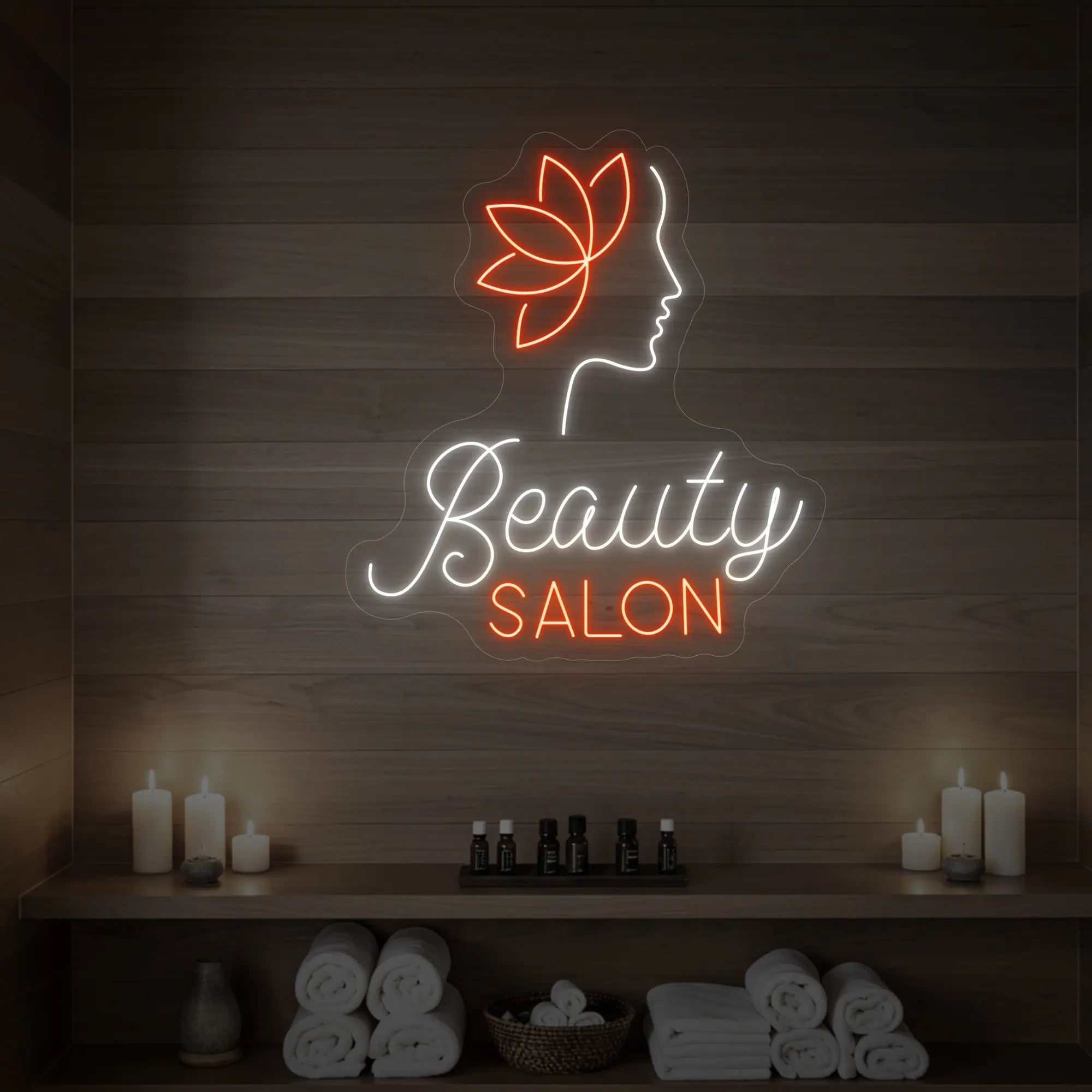 Photo of the 'Beauty Salon' neon sign glowing in cool white and golden yellow against a styled interior wall.