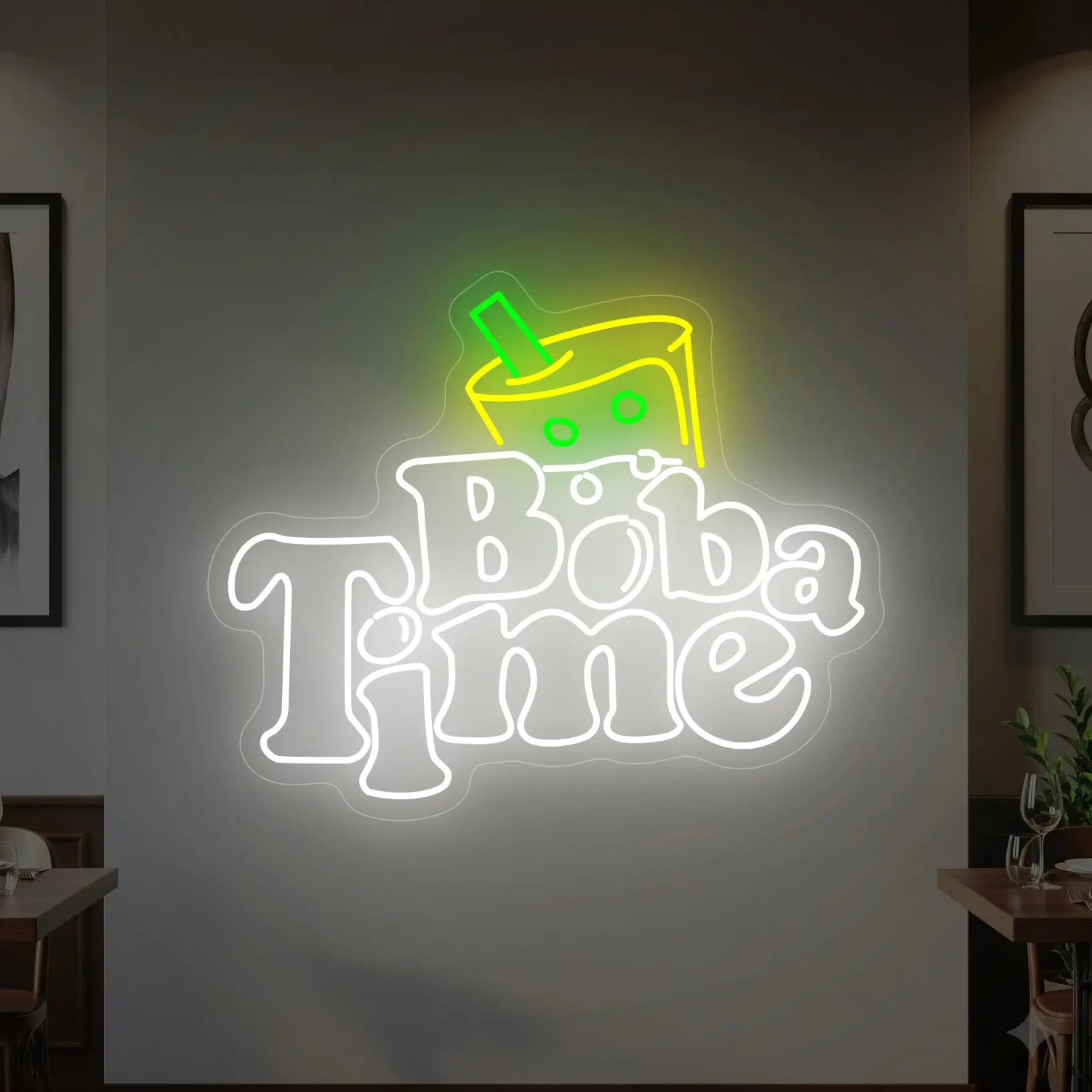 Photo of the 'BOBA TIME' neon sign glowing in cool white, green and yellow against a styled interior wall.