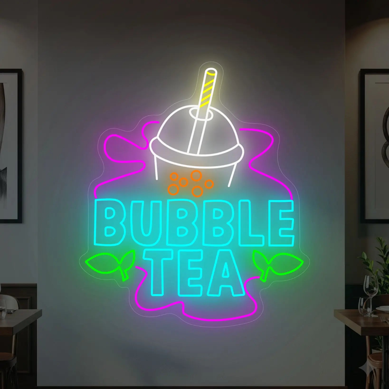 Photo of the 'BUBBLE TEA' neon sign glowing in multi-color against a styled interior wall.