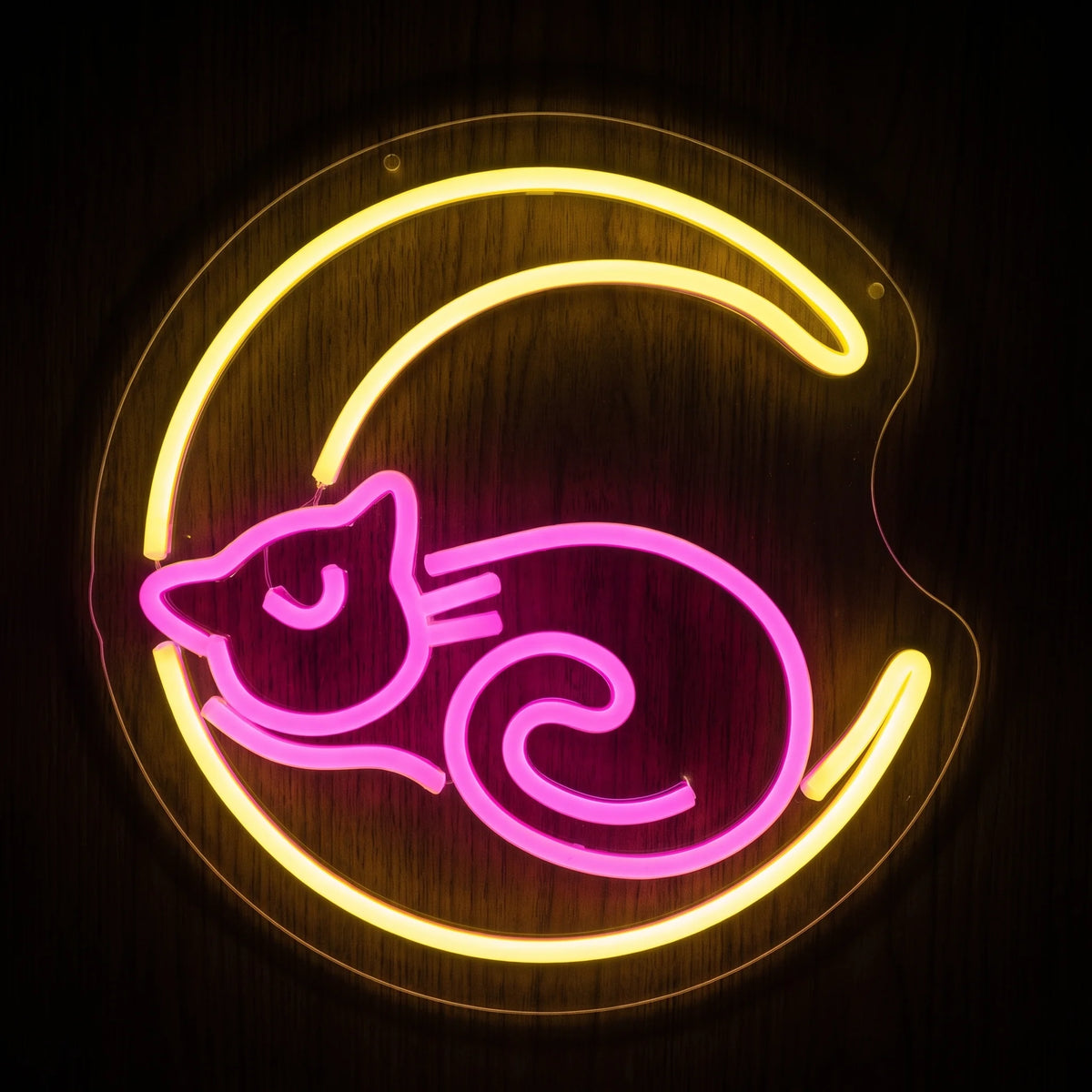 Pink cat on yellow crescent moon LED neon sign with clear acrylic backing.

